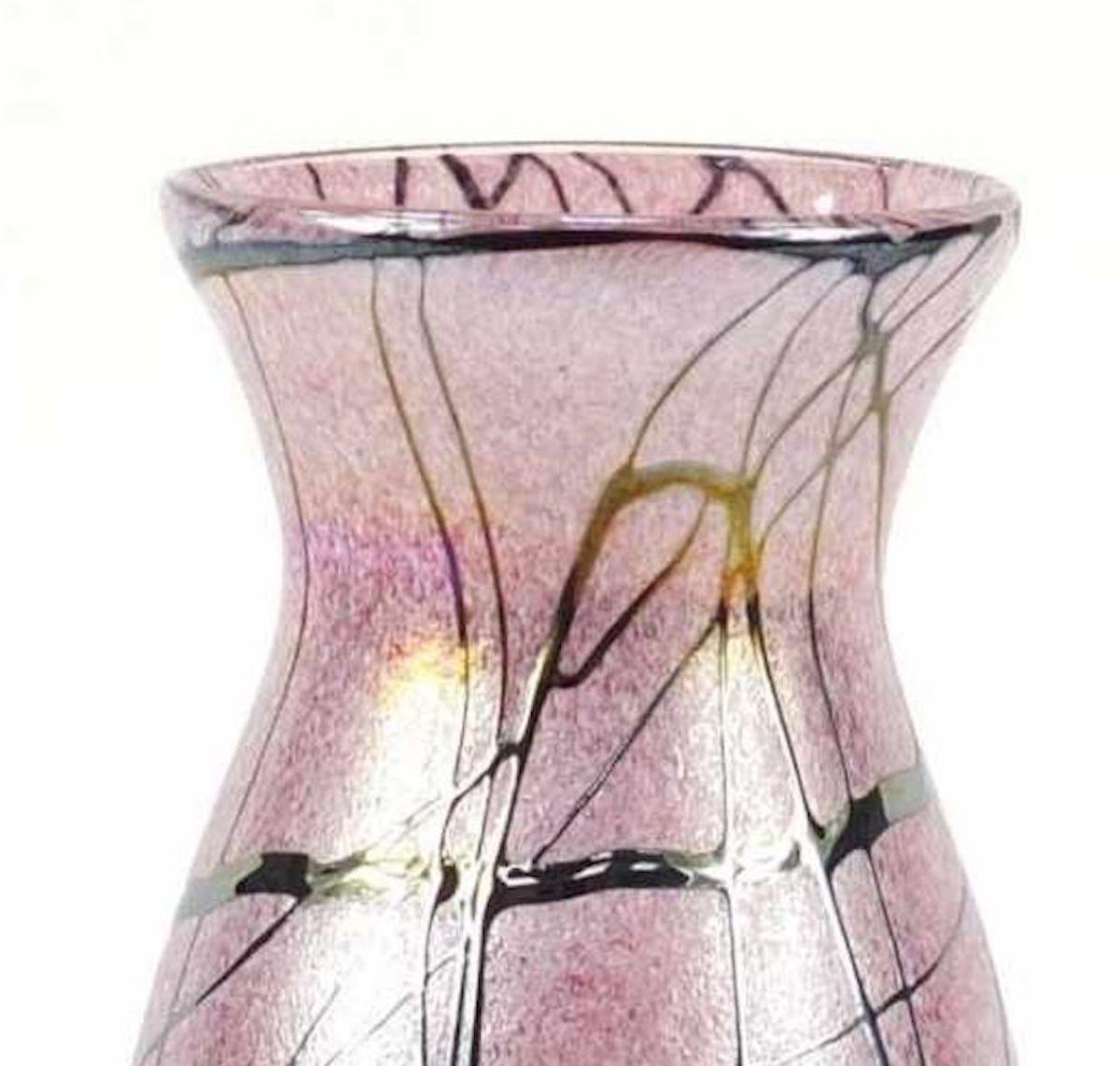 Pink irridescent vase is a beautiful glass vase realized circa 1930s of 20th century.

Our specimen is realized in pink iridescent glass exalted by the intersected black line, which could be yours at affordable prices!

Very good conditions.