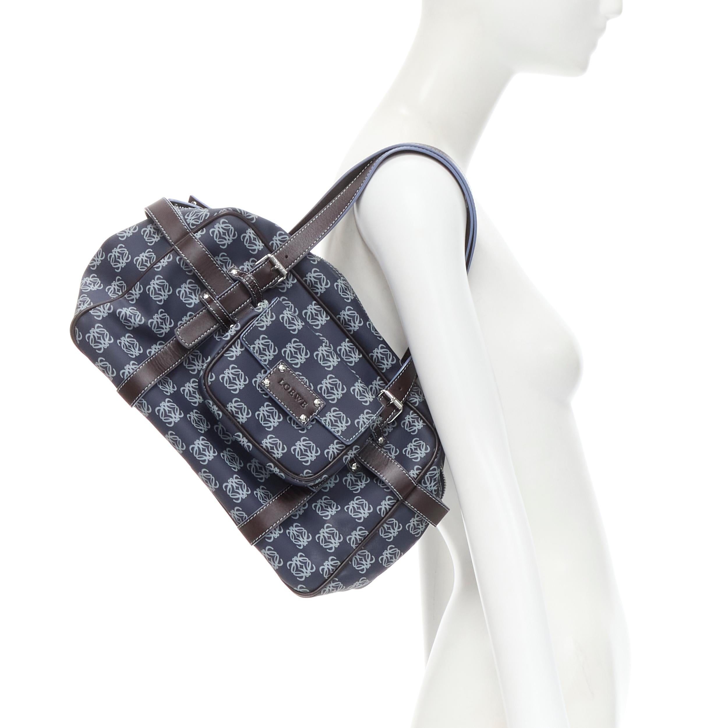 vintage LOEWE blue Anagram canvas brown strap detachable pouch Boston bag 
Reference: CELG/A00026 
Brand: Loewe 
Model: Anagram boston bag 
Material: Canvas 
Color: Blue 
Pattern: Abstract 
Closure: Zip Extra Detail: Detachable small pouch. 
Made