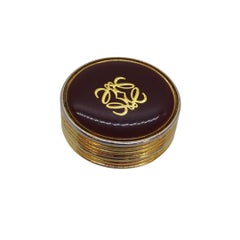 Vintage Loewe pillbox with screw-on lid, in gold-plated metal, and brown enamel