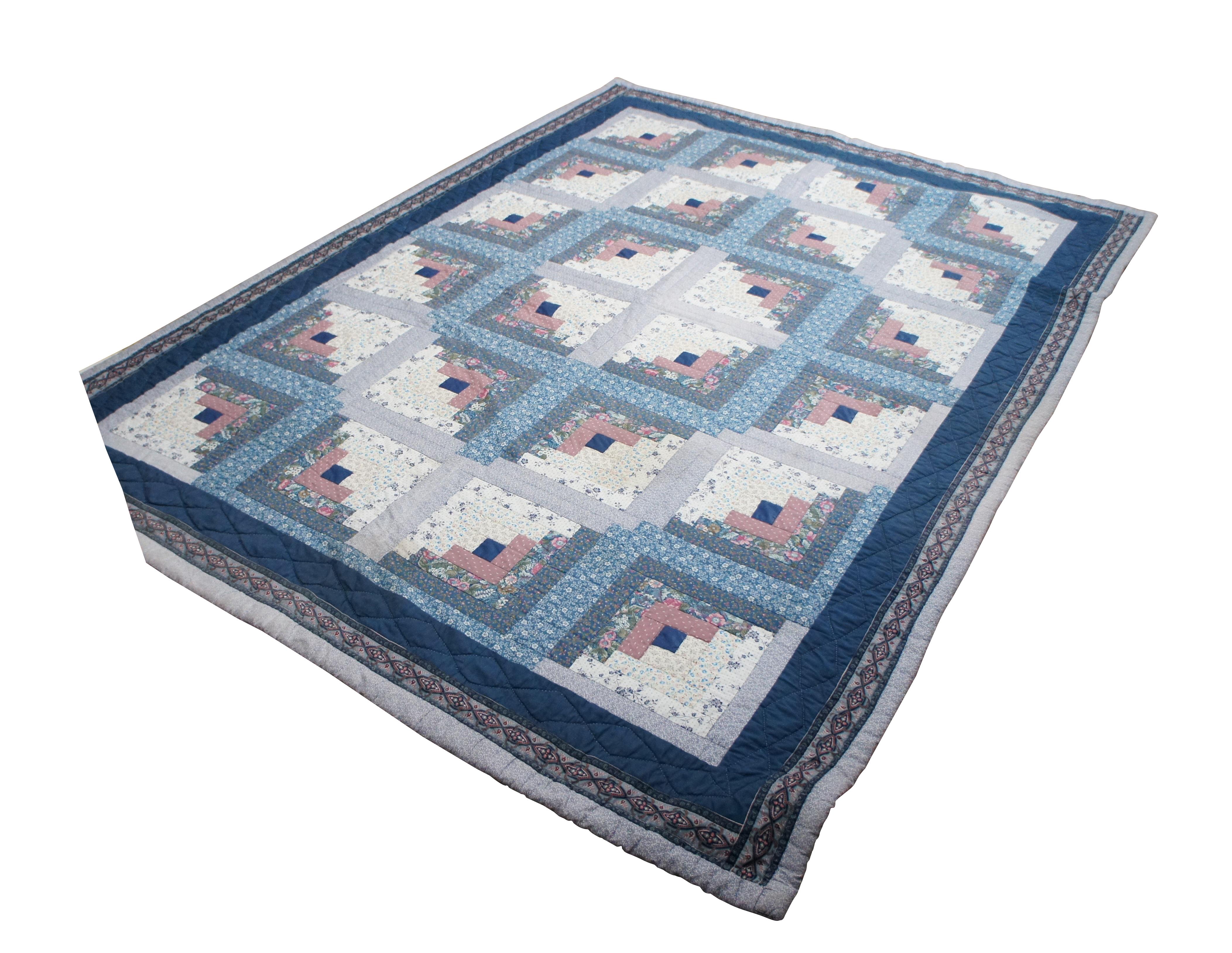 Vintage hand stitched quilt, blanket or bedspread featuring the traditional Log Cabin geometric design with squares, crosses and floral motifs.  Full to queen size.

The Log Cabin block pattern is the oldest of quilt designs, and perhaps the most