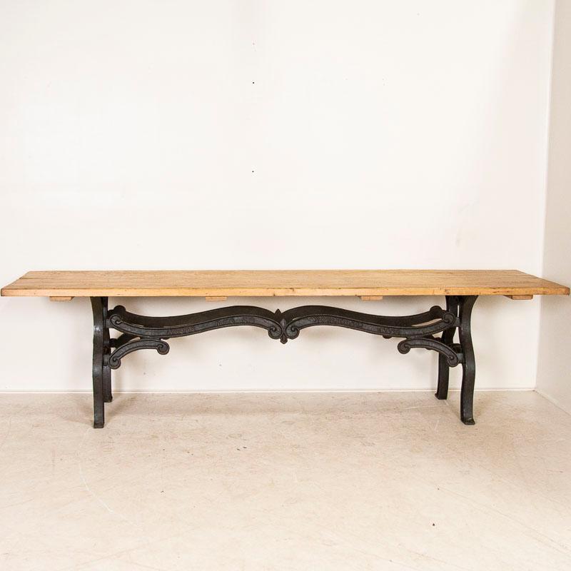 This remarkable long table is made from one solid pine plank of wood, circa 1860-80. Note the gouges, scratches and marks which indicate it was likely used as a work table which adds to its authentic vintage character. This 9.75