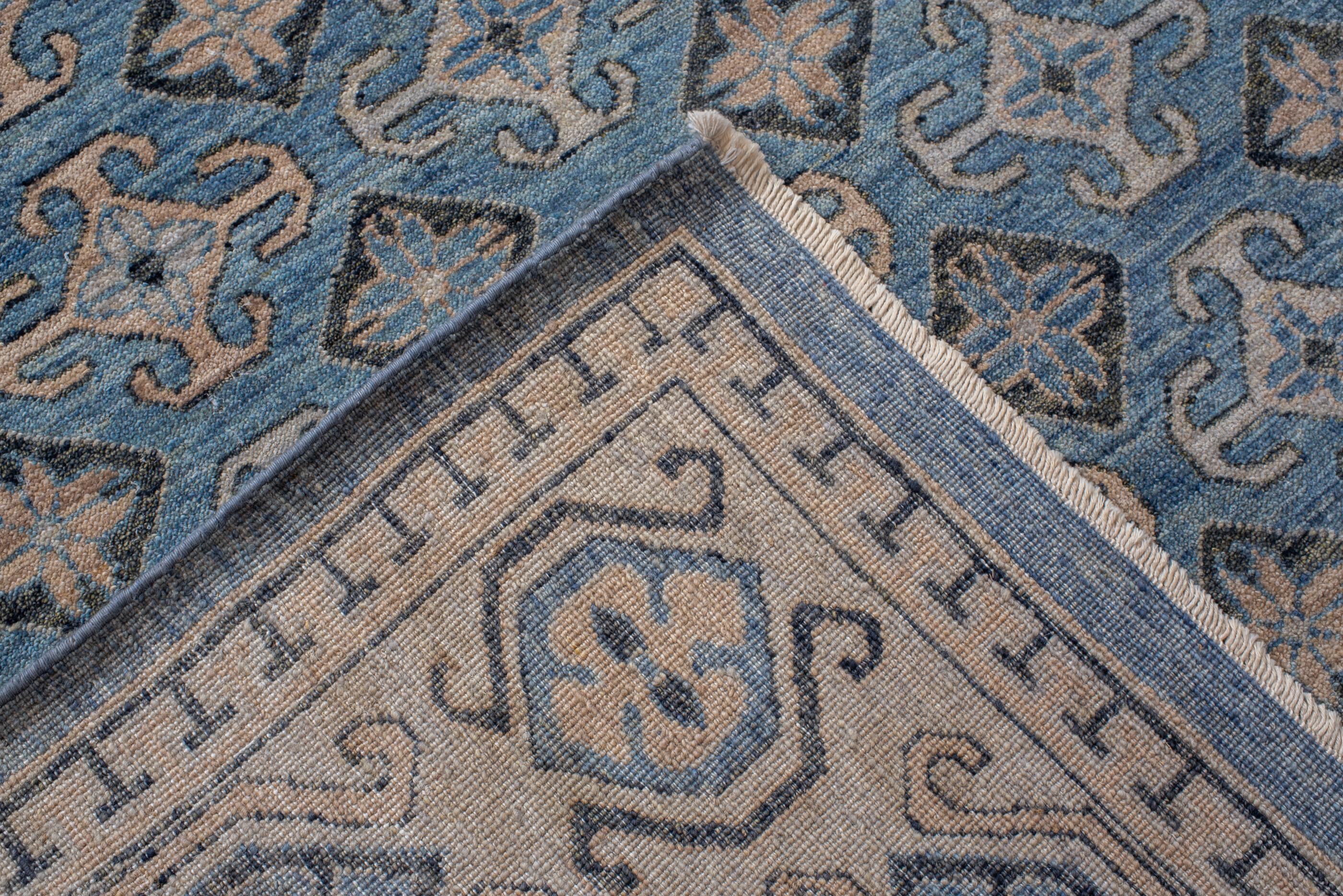 Wool Vintage Long and Narrow Khotan with Blue Medallions  For Sale