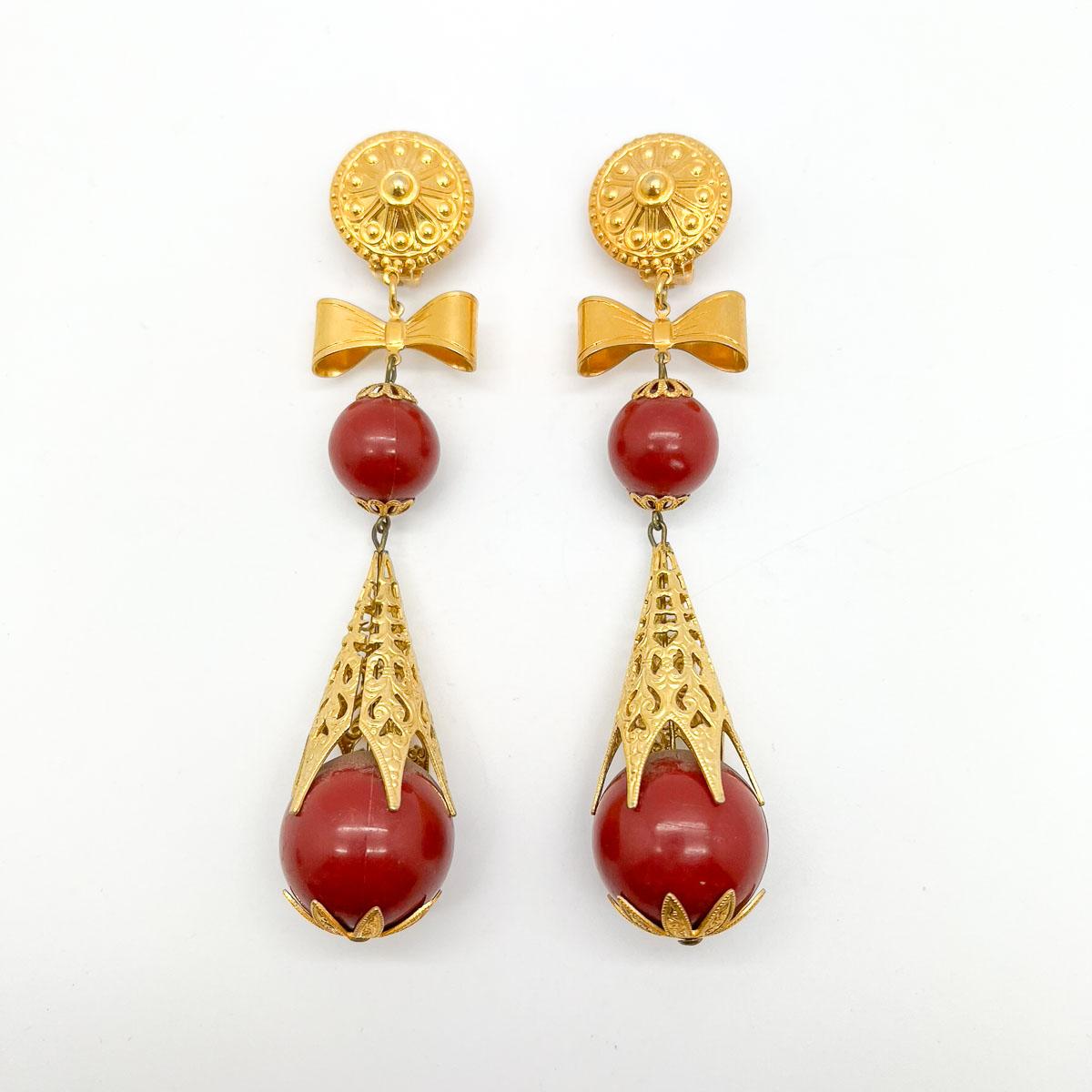 Vintage Filigree Bomb Earrings hailing originally from Italy and the 1970s. With their true shoulder duster proportions and exquisite attention to detail, these glorious statement earrings are certain to transform your look.

Vintage Condition: Very