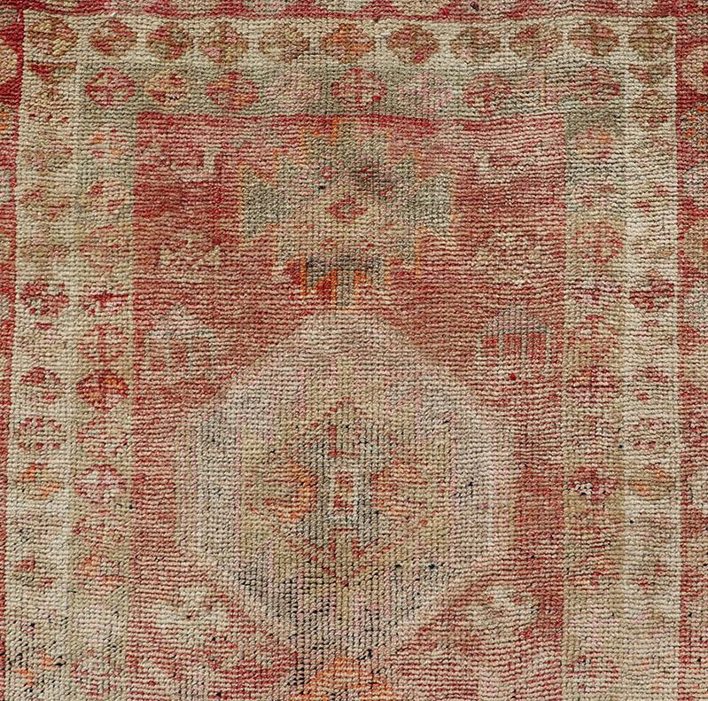 Hand-Knotted Vintage Long Turkish Oushak Runner with Tribal Medallions in Soft Red For Sale