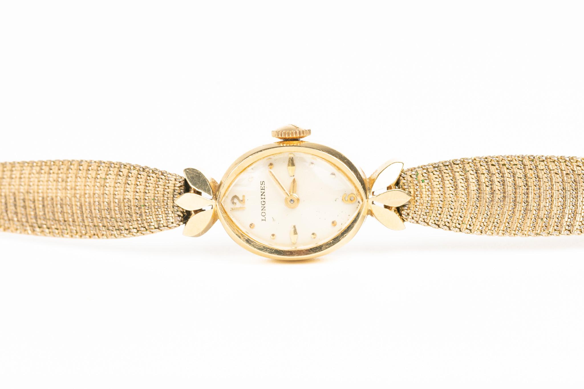 An elegant and timeless 14ct Gold Longines Lady's Bracelet Watch with an original and beautiful gold-plated bracelet and accompanying gold watch face. With its elegant look, this Longines watch combines vintage art deco style aesthetic and