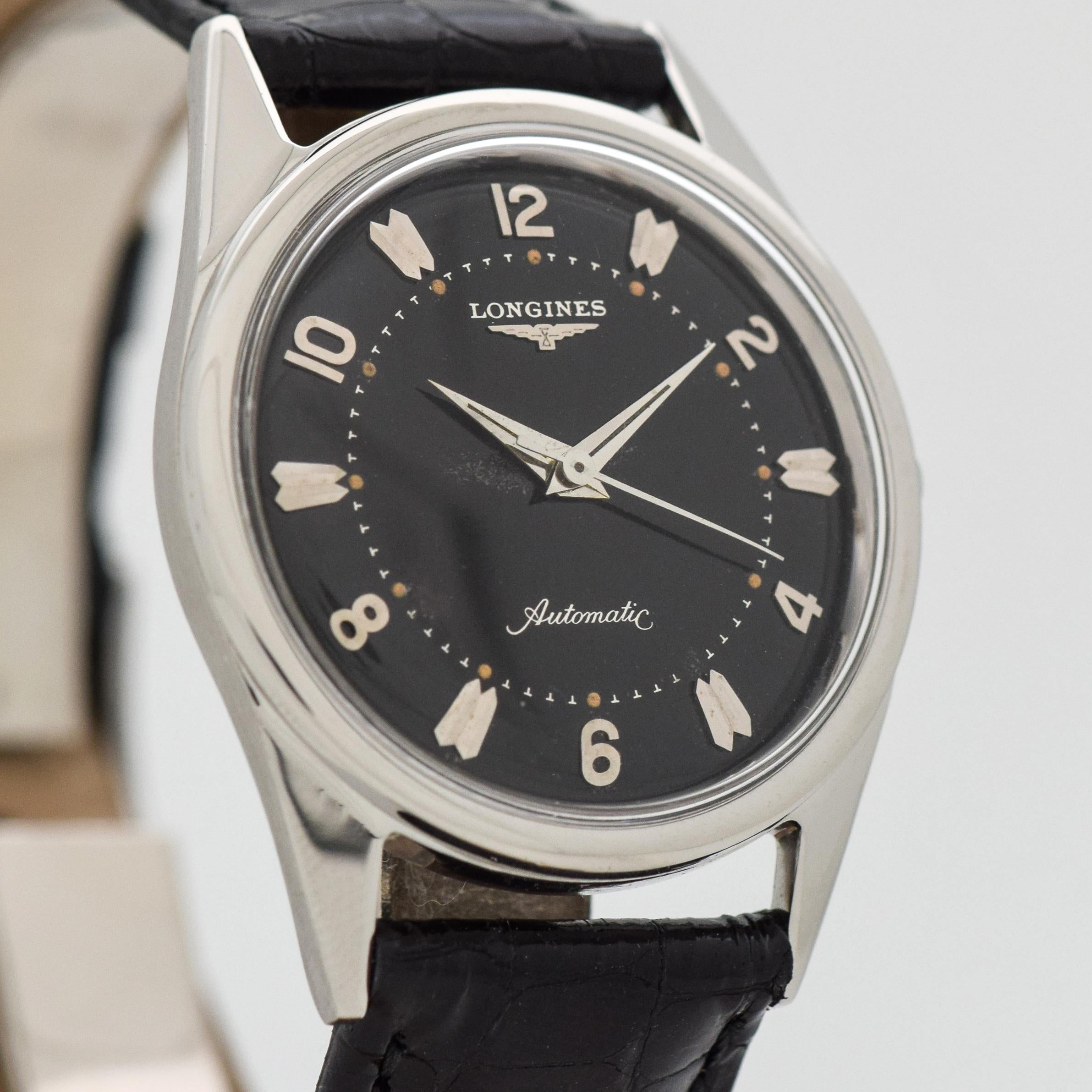 1958 Vintage Longines Ref. 2309-SW Stainless Steel watch with Original Black Dial with Applied Steel Arabic Even Numbers with Tapered Pointed Ends Beveled Double Bar Markers. 32mm x 41mm lug to lug (1.26 in. x 1.61 in.) - 17 jewel, manual caliber