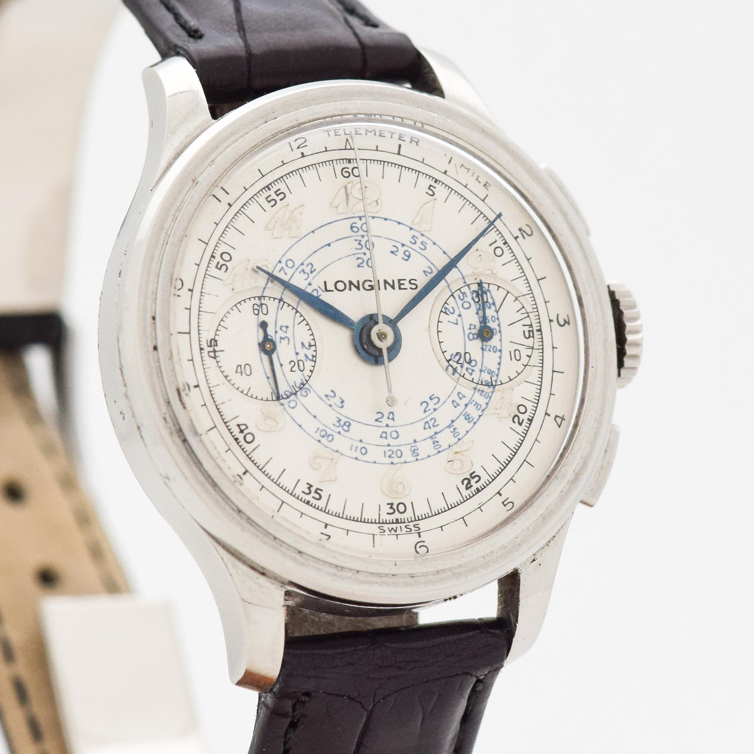 1939 Vintage Longines 2 Register Flyback Chronograph HIGHLY COLLECTIBLE Caliber 13ZN Ref. 3870 Stainless Steel watch with Restored Silver Dial with Applied Silver Colored Arabic Numbers with Unique Blue Inner Tachometer Track. 34mm x 40mm lug to lug