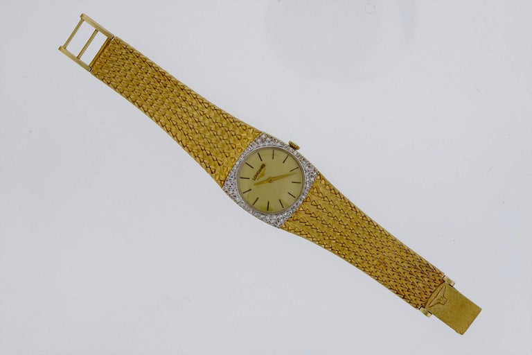 Elegant watch in excellent vintage condition.   Solid 14k gold case and flexible mesh bracelet with full diamond bezel.  Fold over clasp with Longines logo.  Circa 1970s.  Hand-winding mechanical movement in working condition.  Professionally