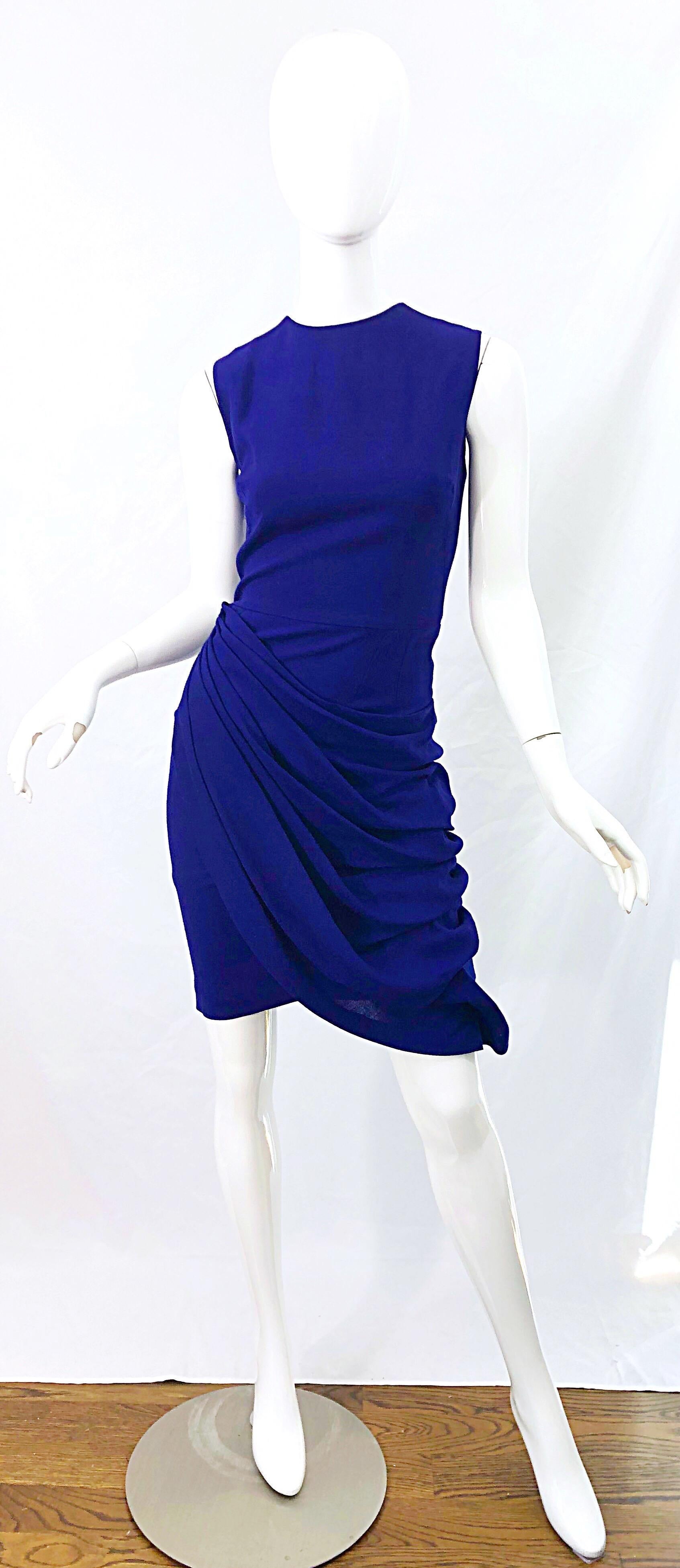 Beautiful vintage early 2000s LORIS AZZARO purple ruched sheath dress ! Features a tailored bodice with flattering and forgiving gathered skirt. 15 large rhinestone buttons up the back. Very well made with heavy attention to details that mirror that