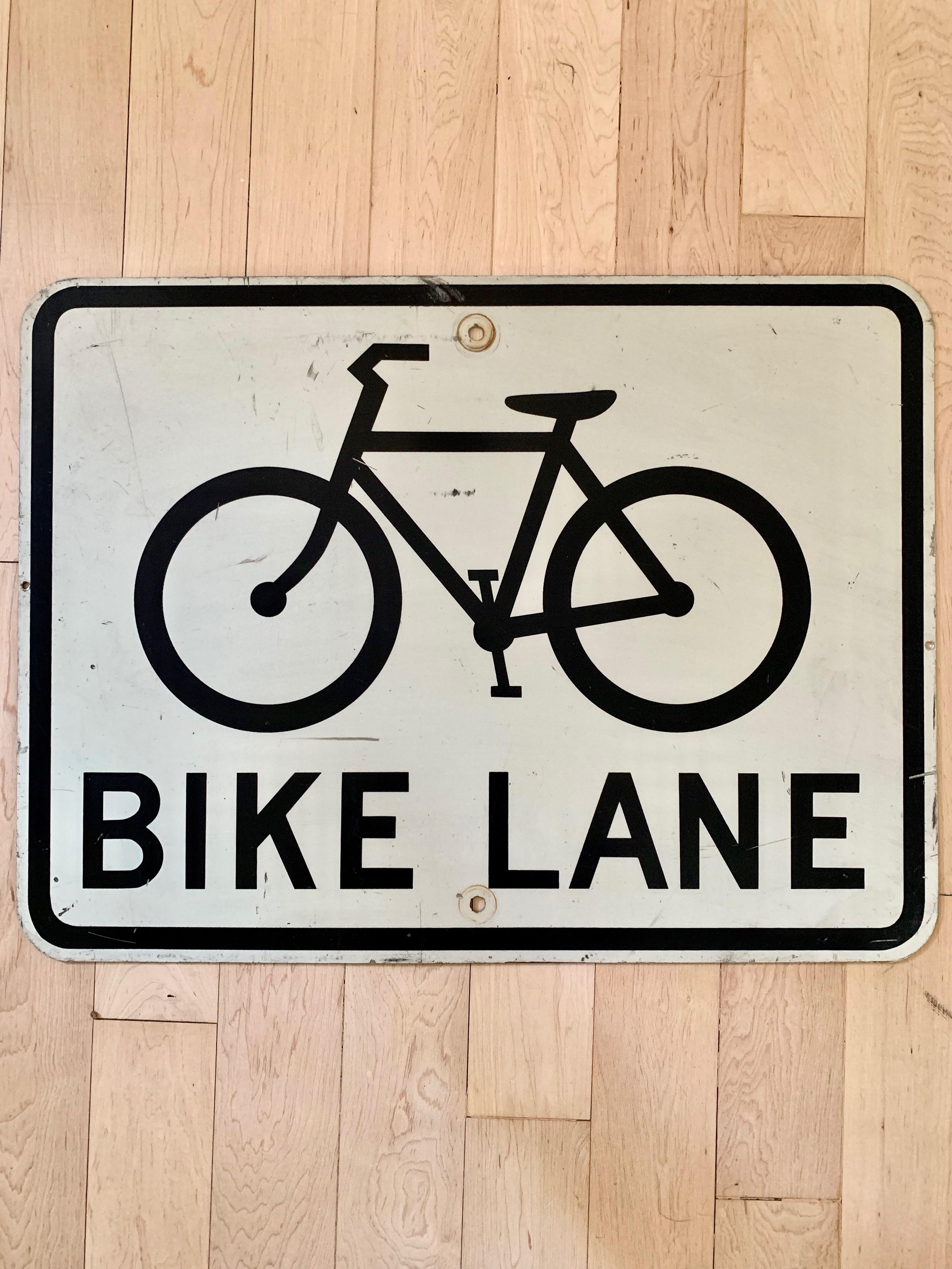 Vintage steel bike lane sign from the streets of Los Angeles, California. Scratches and signs of use. Marked 