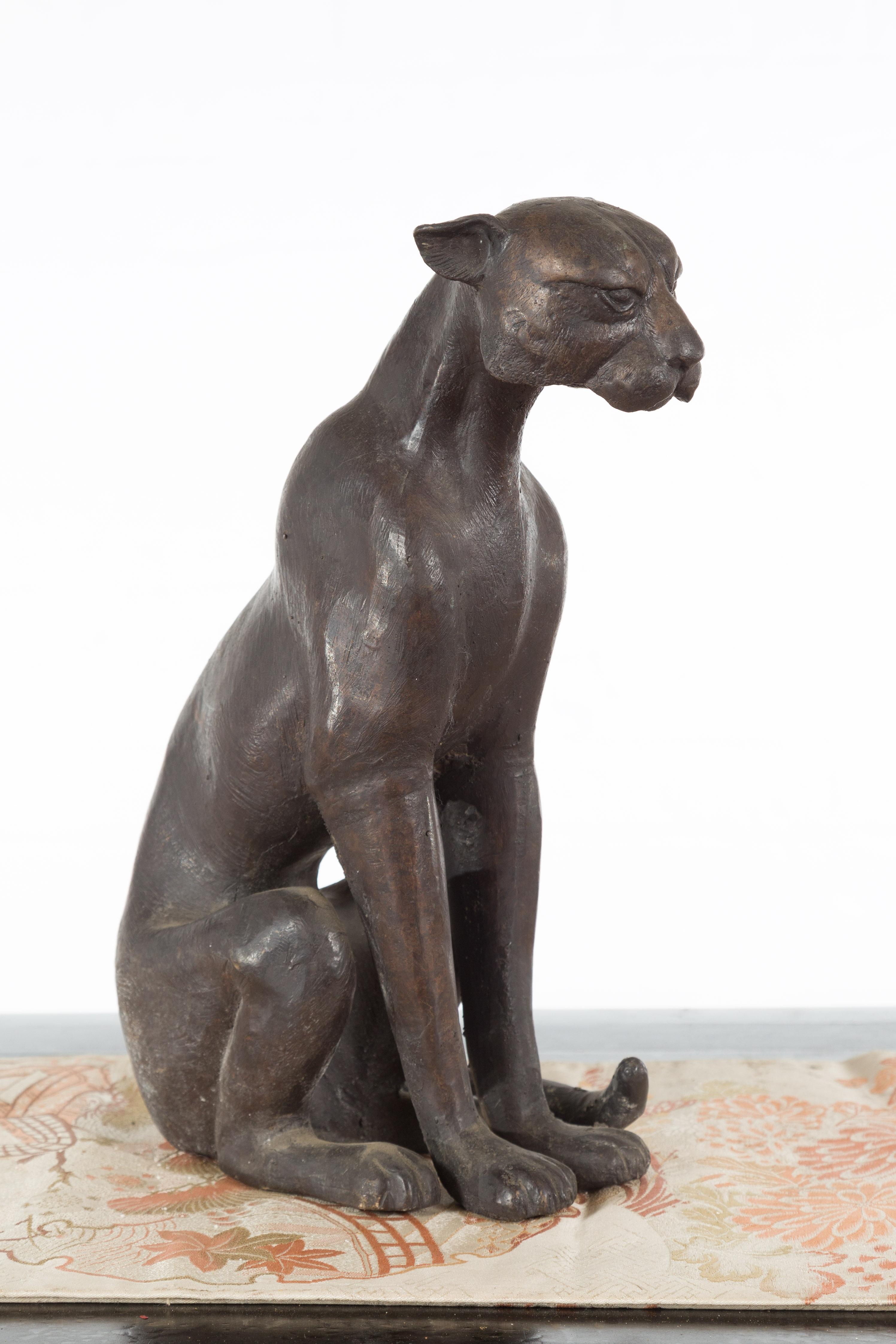 A vintage lost wax cast bronze statue of a cat from the mid 20th century, with bronze patina. We currently have two available, priced and sold individually $790 each. Created with the traditional technique of the lost-wax (à la cire perdue) which
