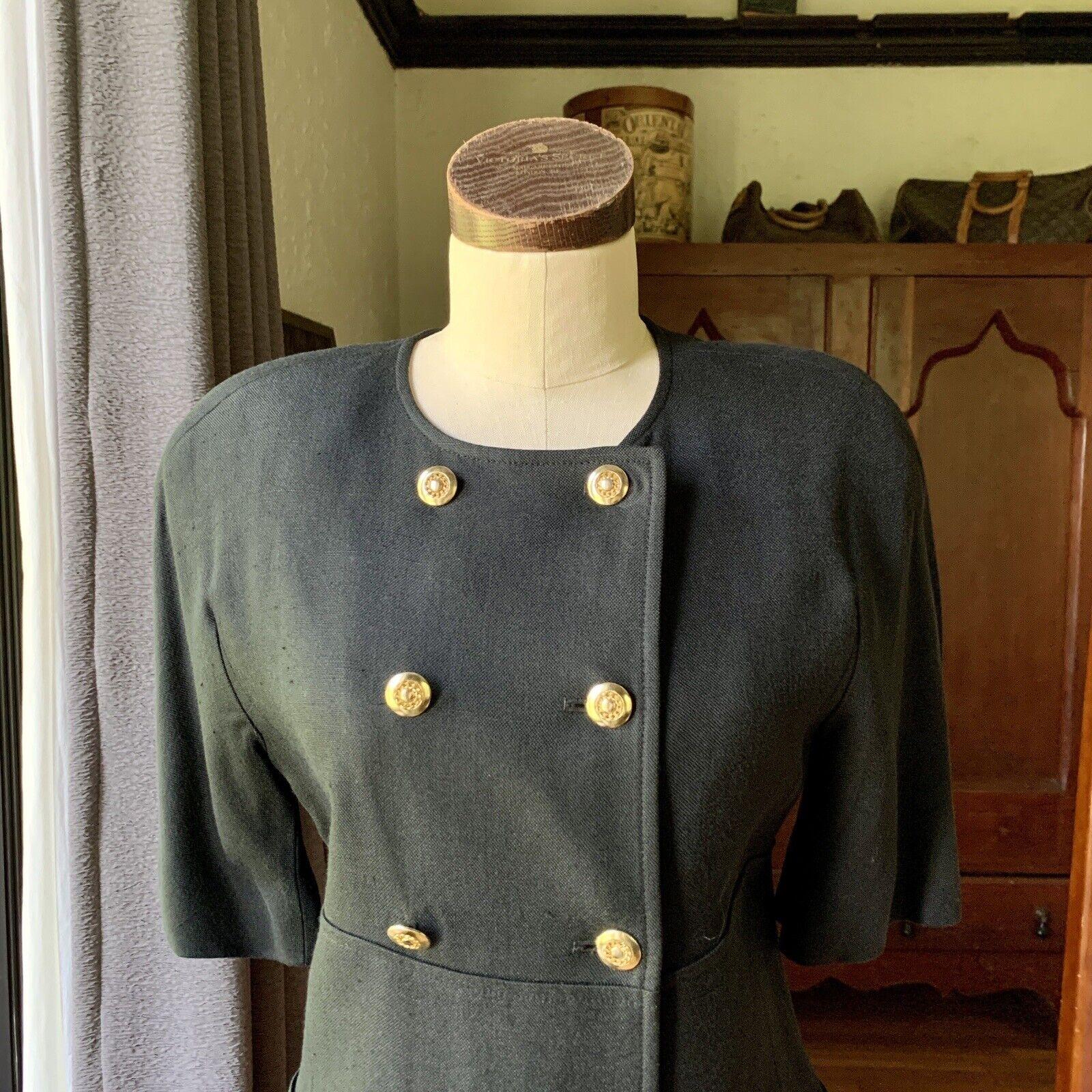 Louis Feraud, Fully Lined, 100% Viscose (Rayon Like)

Jacket - Ten Gold-Tone Buttons, Short Sleeve, Scoop Neckline, Two Shallow Front Pockets, Shoulder Pads

Skirt - Back Zipper with Button

Vintage 6 on Both Pieces.

Measurements Laying Flat

Bust