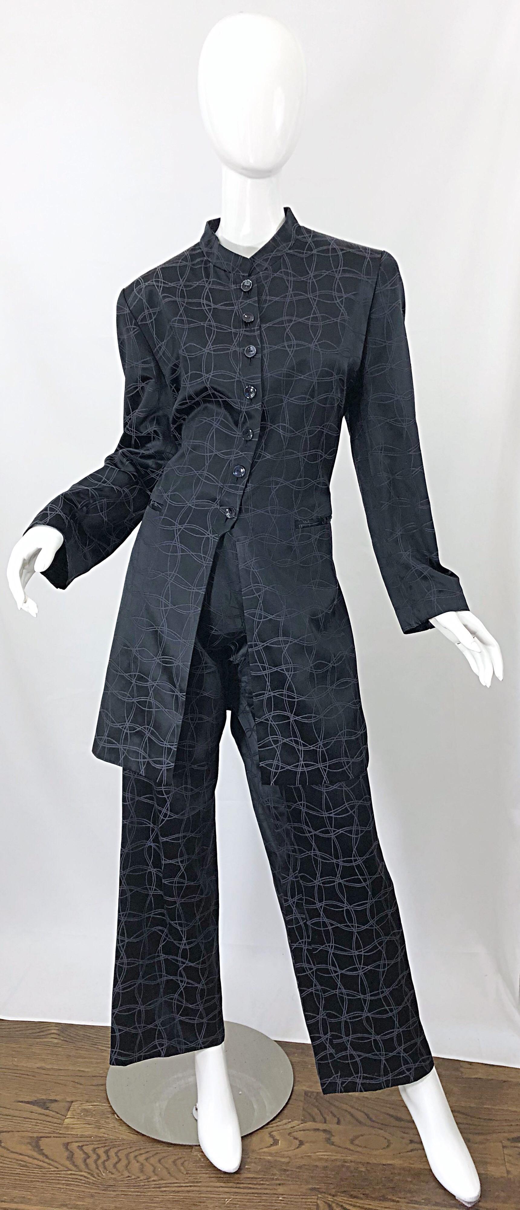 Stylish vintage LOUIS FERAUD Size 14 black silk long jacket wide leg pant suit! Jacket features mandarin colla, with pockets at each side of the waist. Iridescent squiggle lines throughout. High waisted wide leg trousers also feature pockets at each
