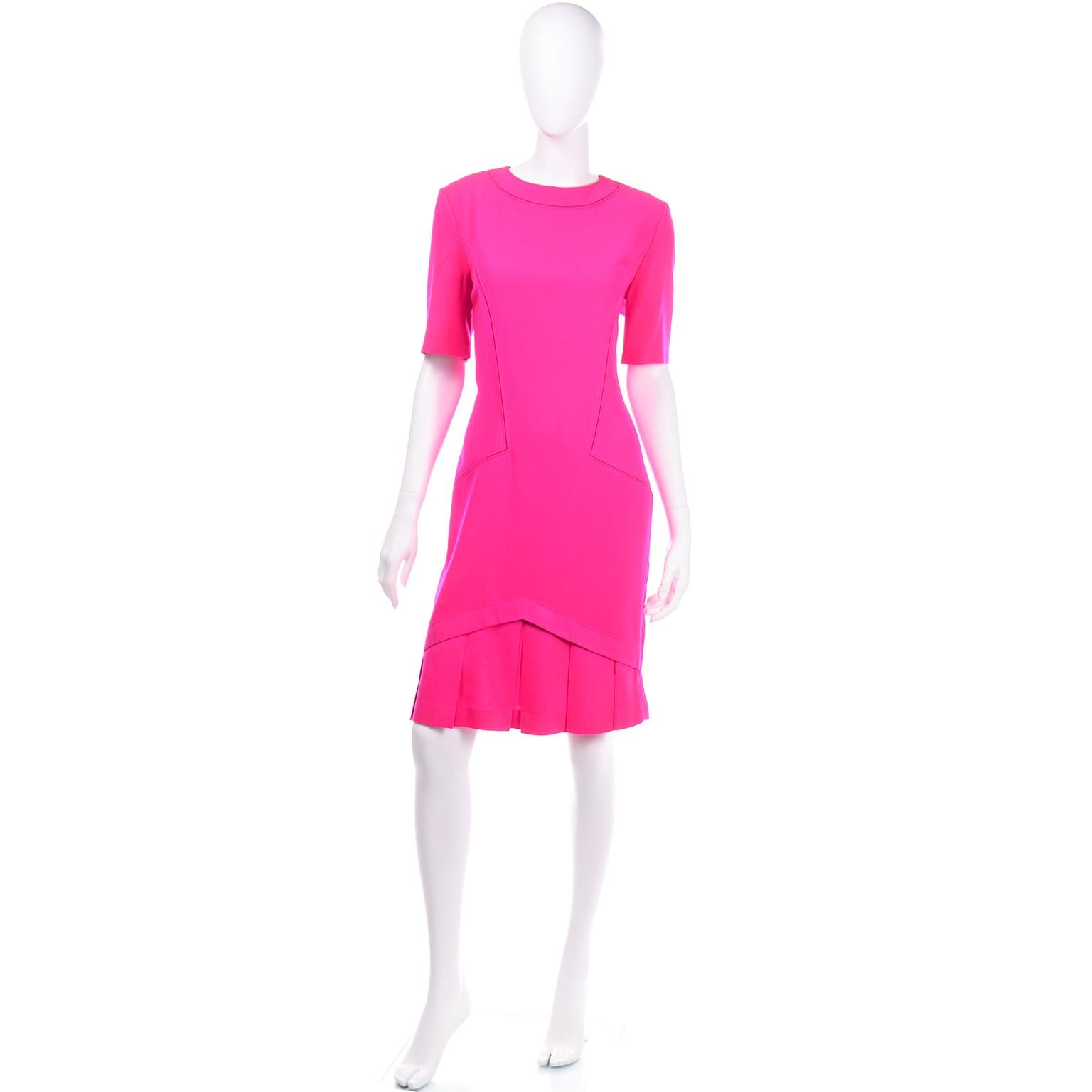 We instantly fell in love with this vintage hot pink Louis Féraud dress! We love finding unique Louis Feraud pieces, and we always have discovered over the years that his pieces are definitely made to  last! This fabulous Spring/Summer weight wool