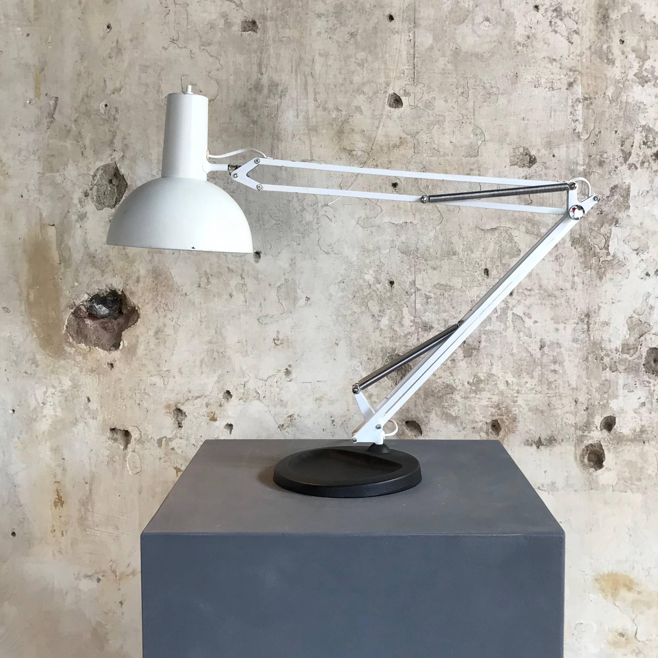 Vintage, industrial and large desk or floor lamp, often referred to as 'The Ghost of PH' and based on the Ideas of Poul Henningsen. These fully adjustable white anglepoise desk or floor Lamp was designed in-house at Louis Poulsen in the early 1970s.