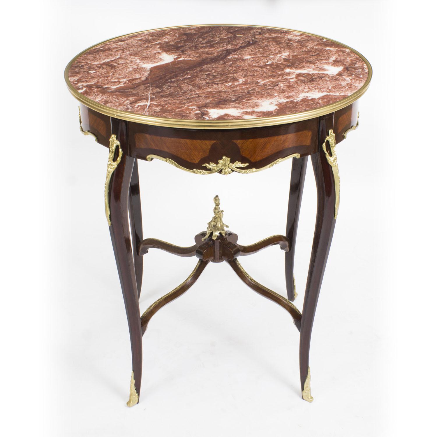 This is a handsome Vintage French Louis Revival occasional table with fabulous ormolu decoration and a 