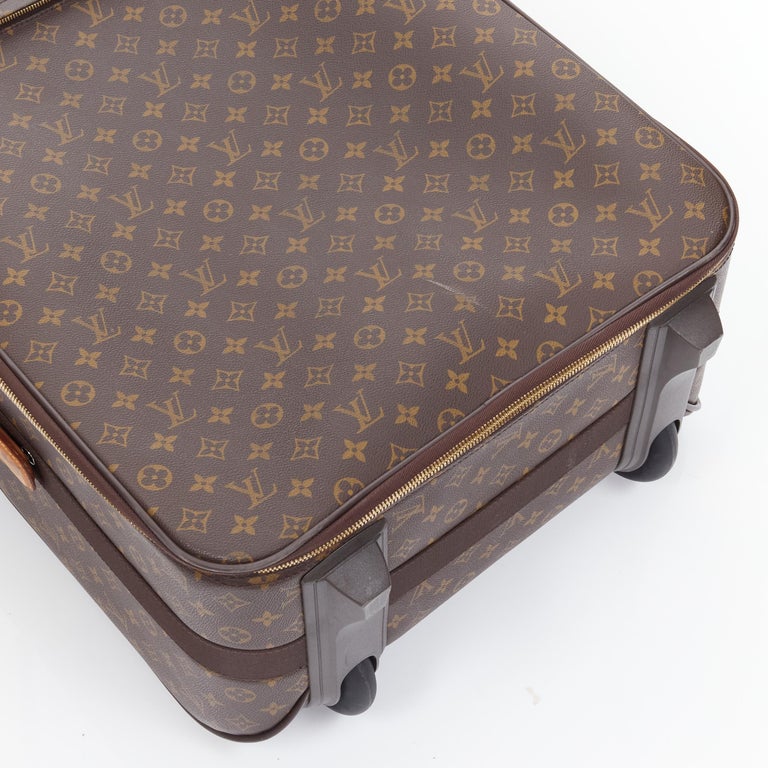Louis Vuitton Pegase 50 Suitcase, in a brown Damier Ebene coated canvas,  with brown leather accents and golden brass hardware, opening to a black  nylo sold at auction on 3rd December