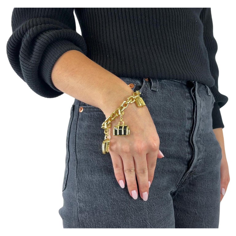Vintage Louis Vuitton 18 Karat Gold Charm Bracelet For Sale at 1stDibs  lv  gold charm bracelet, lv heart bracelet, louis vuitton charm bracelet price