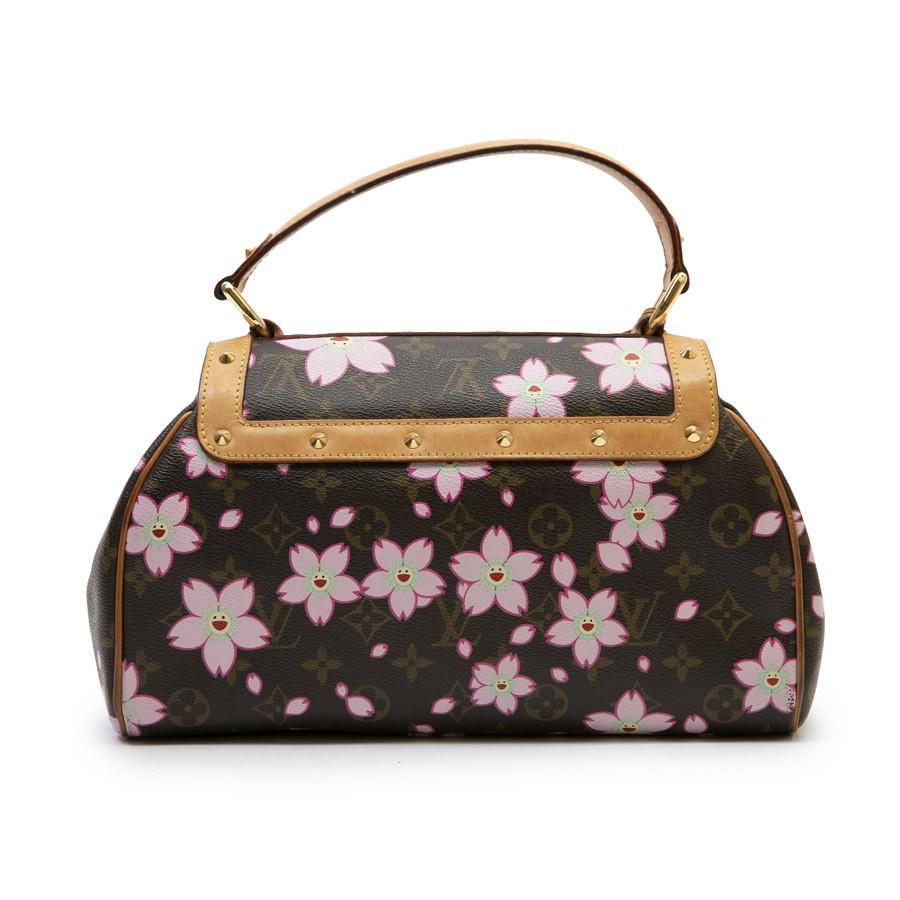 Limited edition. Pre owned Louis Vuitton bag in Monogram brown canvas with floral pattern, model 'Cherry Blossom', done in collaboration with Takashi Murakami. Spring/Summer 2003. Natural cowhide finishes. Gold jewelery. Inner lining in felt fabric