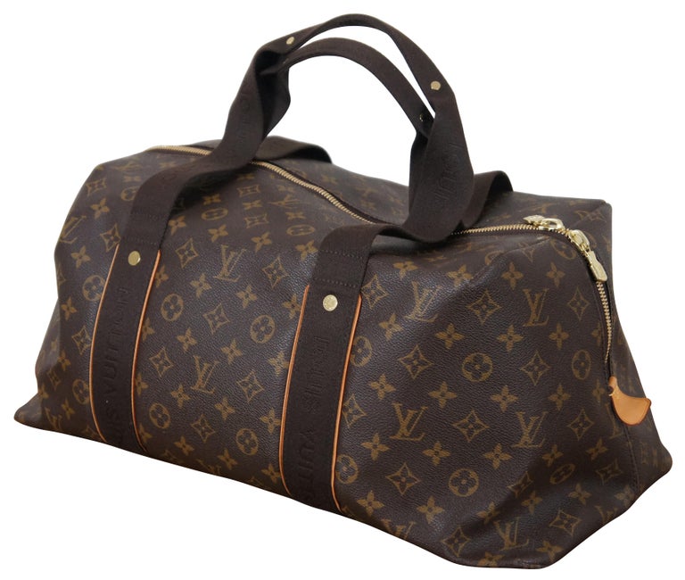 Lot - A Louis Vuitton leather trimmed monogram canvas duffle bag