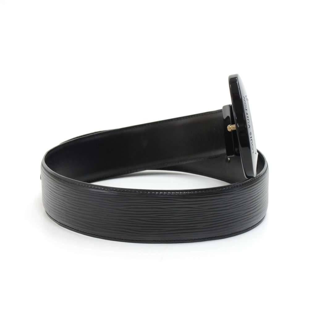 Vintage Louis Vuitton black epi leather waist belt. It has a stylish black resin buckle reminiscent of the classic noctambule bag handles. Great fashion piece to wear over dresses, coats, or jackets!   SKU: LP228Size: Length is adjustable between