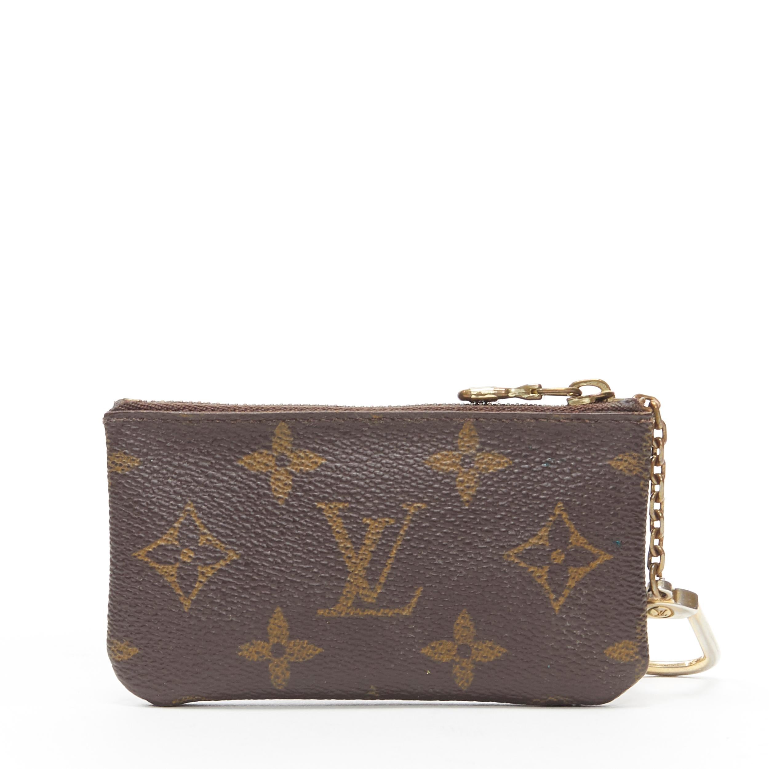 vintage LOUIS VUITTON brown monogram canvas top zip small pouch coins bag
Brand: Louis Vuitton
Model Name / Style: Coins bag
Material: Other; coated canvas
Color: Brown
Pattern: Other
Closure: Zip
Extra Detail: Lobster clasp on chain.
Made in: