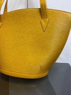Vintage Louis Vuitton bucket bag in mustard color Epi leather.