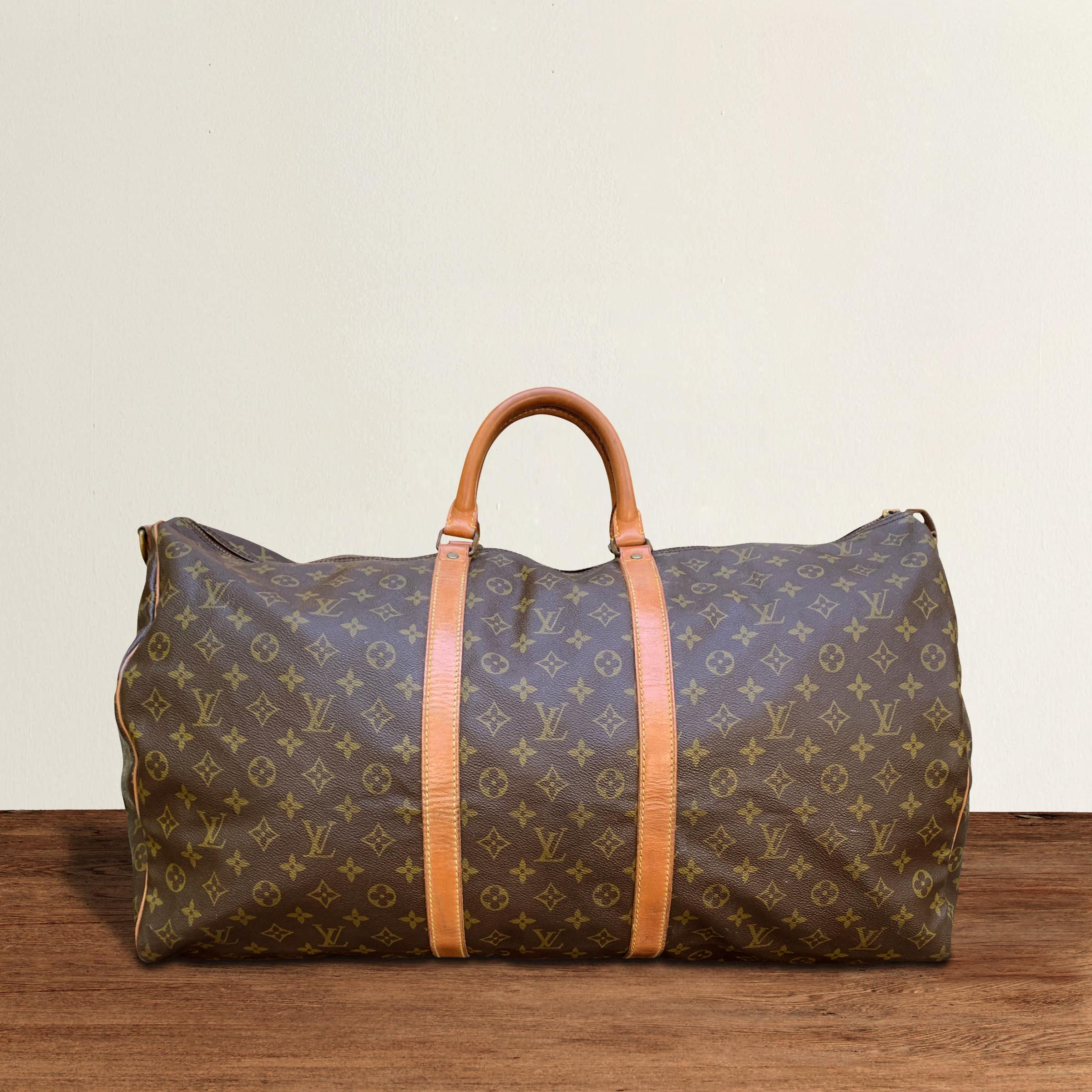 A vintage Louis Vuitton duffle bag made using the classic 