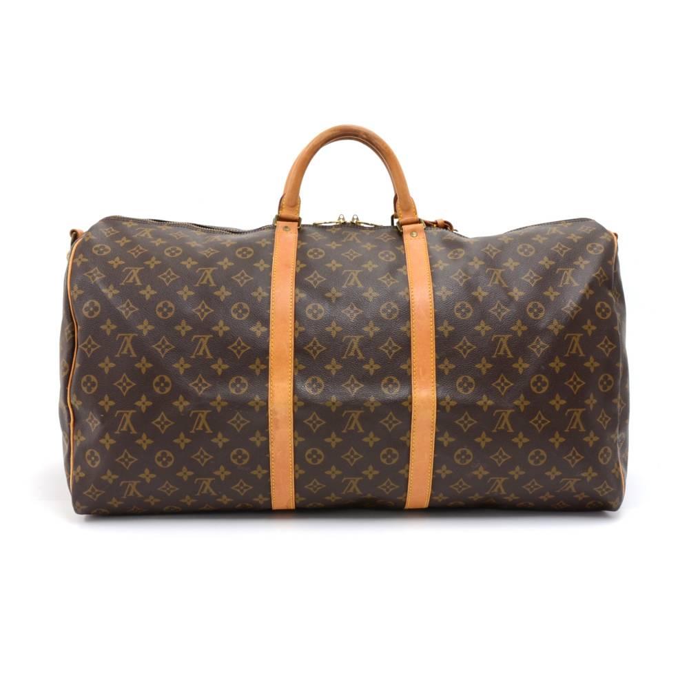 Vintage Louis Vuitton Keepall Bandouliere 60 a classic from the Louis Vuitton travel bag collection. This spacious largest sized version in Monogram canvas and a double zipper for secure and easy access. Great for any trip!It comes with name tag and
