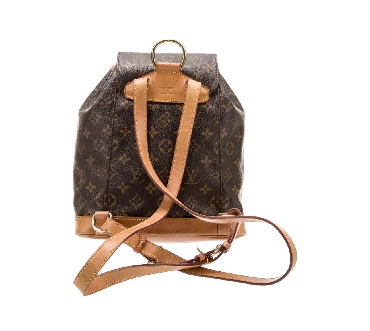 Louis Vuitton Backpack
From the 2001 Collection
Vintage
Brown Coated Canvas
LV Monogram
Brass Hardware
Leather Trim
Dual Adjustable Shoulder Straps
Leather Trim Embellishment & Single Exterior Pocket
Canvas Lining & Single Interior Pocket
Buckle