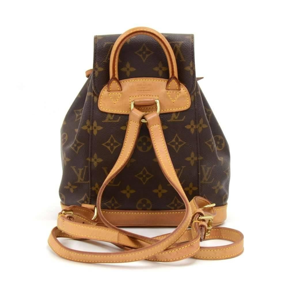 Vintage Louis Vuitton Mini Montsouris backpack in monogram canvas. It has 1 zipper pocket on the front. It has leather drawstring closure with a belted flap top for security. Spacious and classy, it would make a great companion wherever you go! SKU: