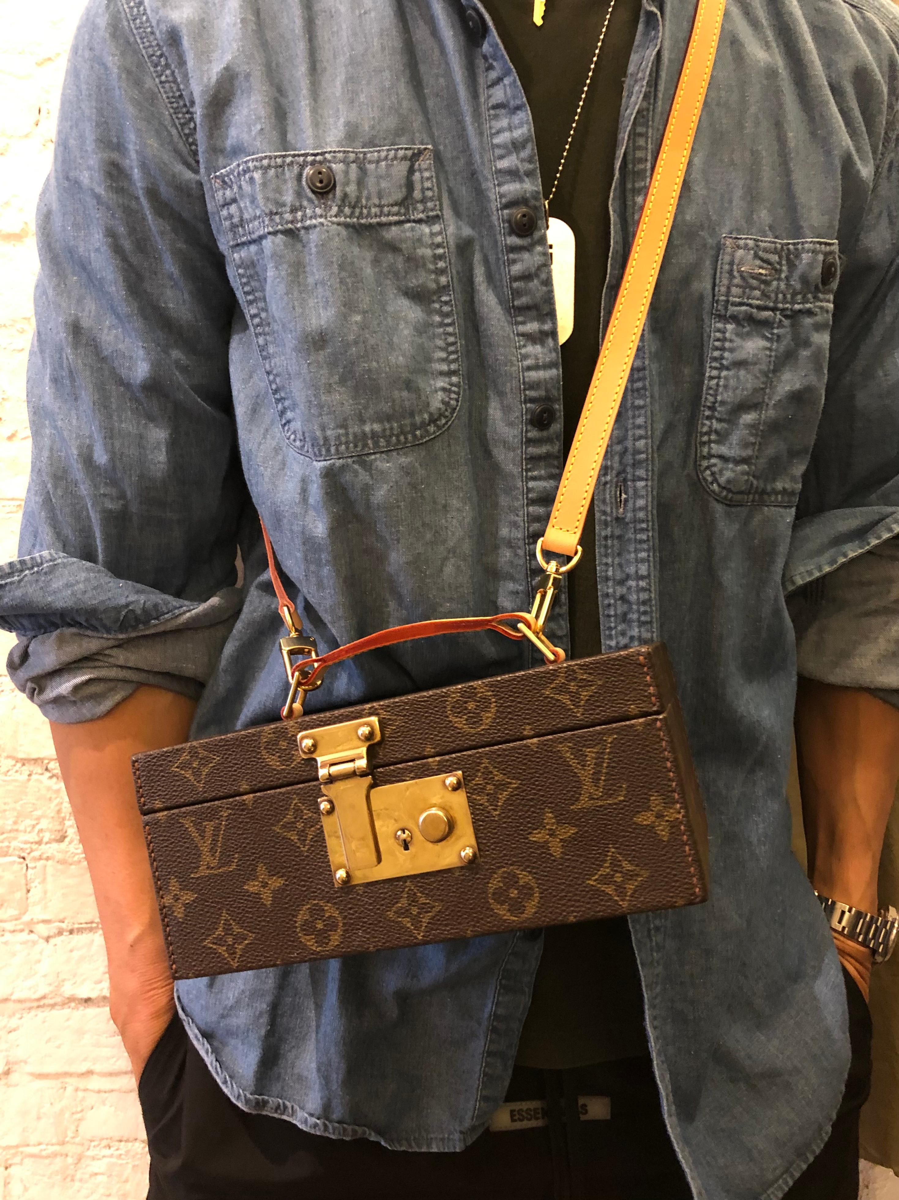 This vintage LOUIS VUITTON jewelry trunk case is crafted of Louis Vuitton’s monogram canvas in brown and vachetta leather. Vachetta leather handle was replaced by Louis Vuitton. Front spring lock closure opens to a velvet interior featuring a velvet