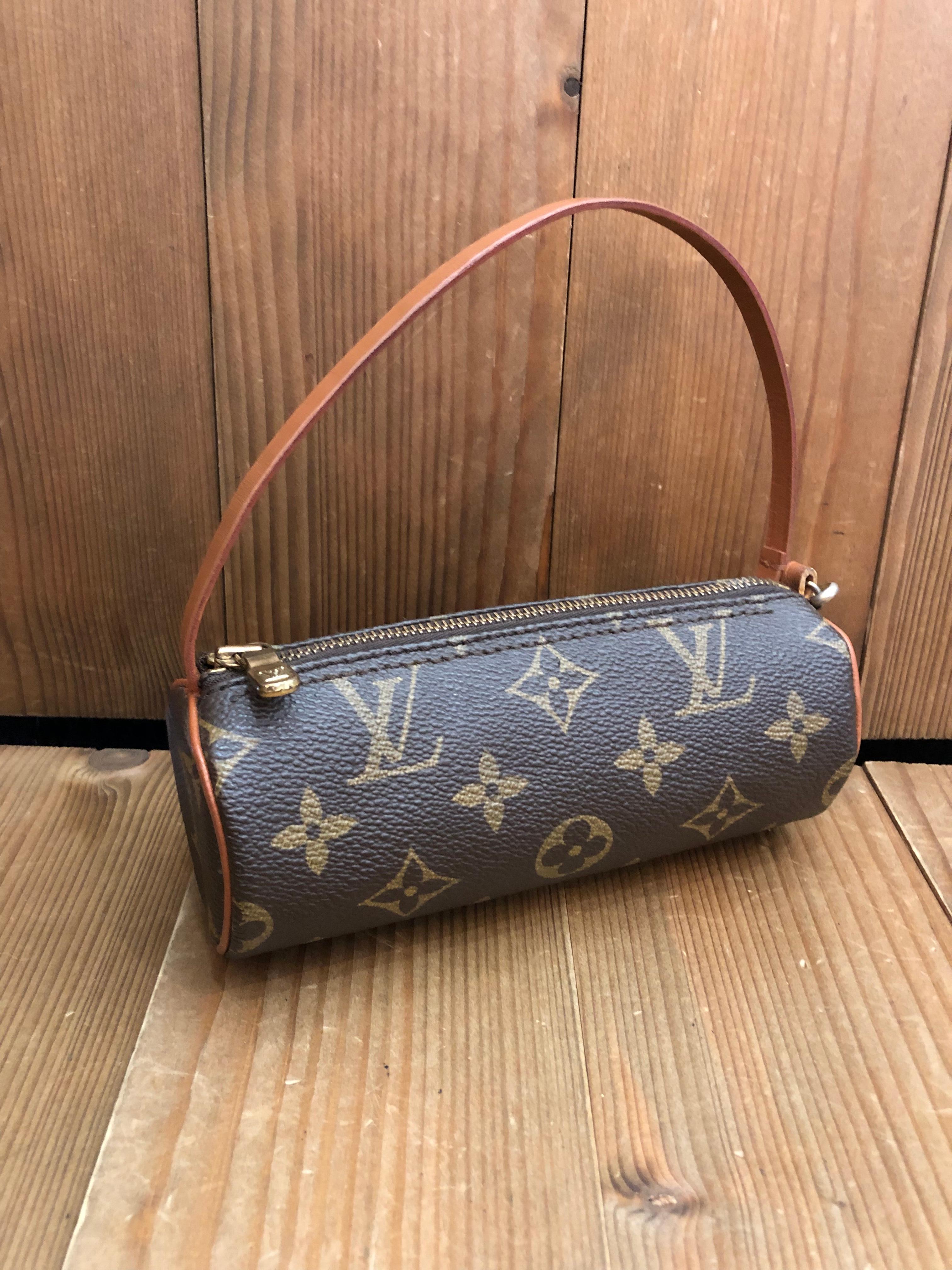 Vintage LOUIS VUITTON mini Papillon pouch in brown monogram canvas and leather. Measures 6.25”x 2.25”x 2.25”. Comes with complimentary non-Lv chain. 

Condition - Generally in good vintage condition with some signs of wear. Note: Leather strap and