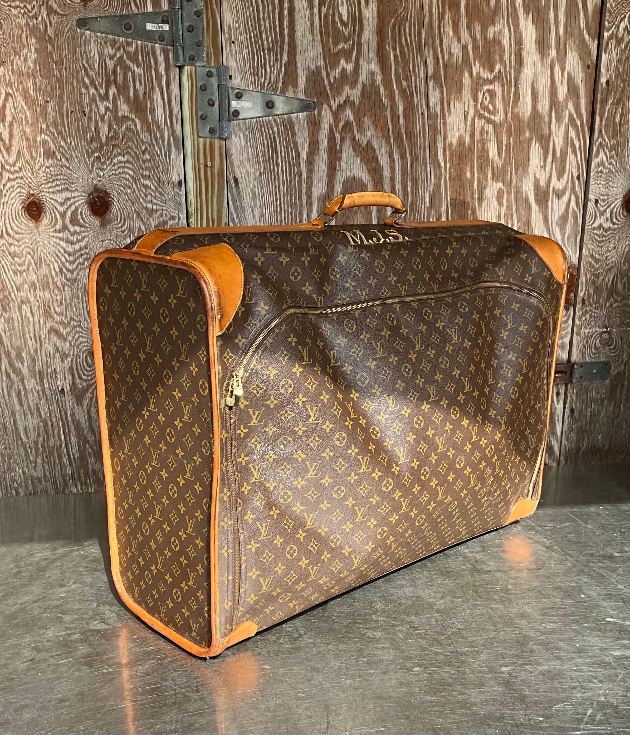 This Vintage Louis Vuitton Monogram Pullman Suitcase is more than just a functional travel accessory; it is a statement of luxury, style, and prestige. The iconic monogram canvas, combined with high-quality craftsmanship and durable materials, makes
