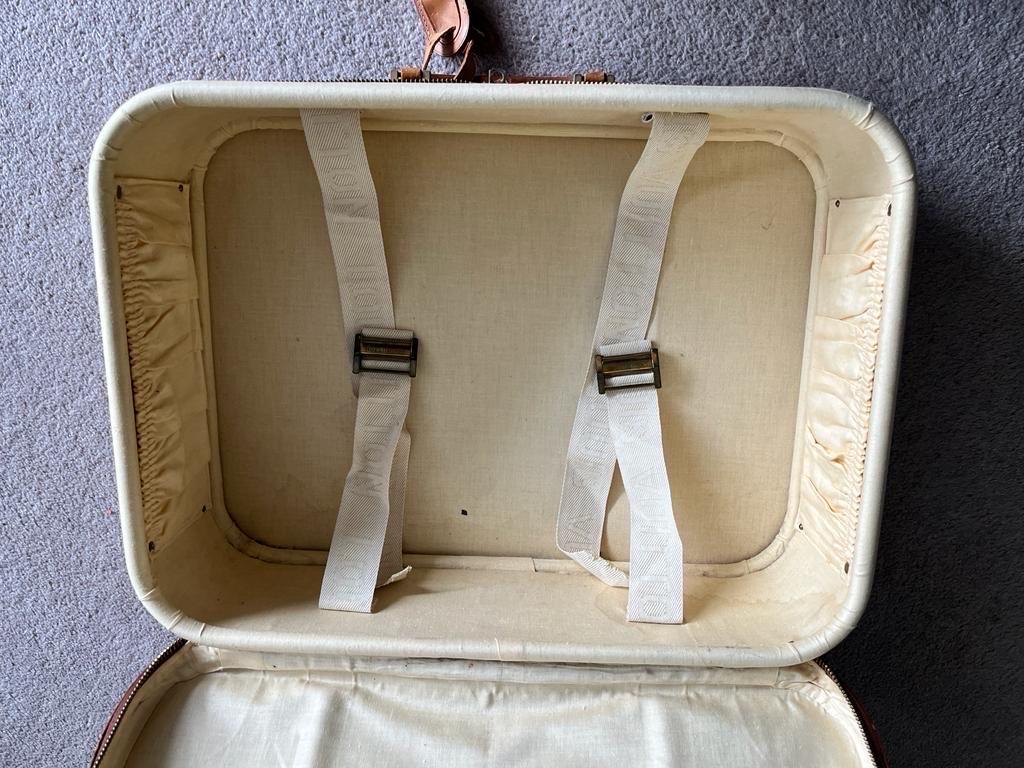 This Louis Vuitton vintage suitcase is a must-have for any collector or fashion lover. It is part of the 1985 LV Stratos collection, expertly crafted from high-quality leather and canvas materials, it is not only durable but also stylish. The famous