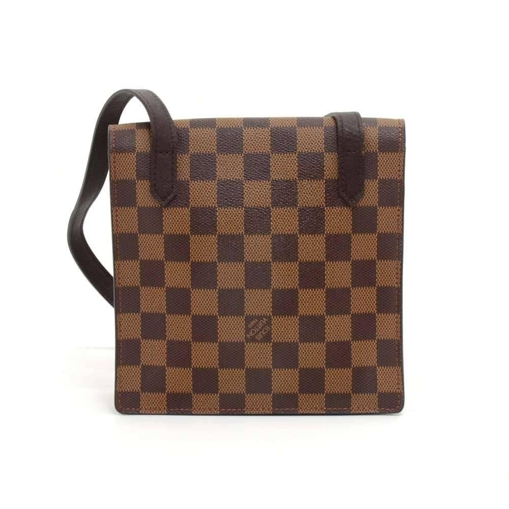 Vintage Louis Vuitton Pimlico bag in Damier canvas. It has flap with stud button on the front. Inside is in orange alkantra lining.  It can be carried on the shoulder or across the body with an adjustable strap. Fashionable and simple. Great for