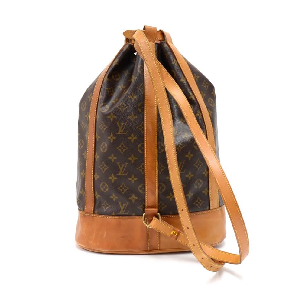 Vintage Louis Vuitton Randonee GM in monogram canvas. It can be carried on one shoulder or as a backpack. Comes with a detachable canvas pouch and a nametag.  Very rare to find.   SKU: LO881
Made in: France
Serial Number: AS1905
Size: 12.5 x 6.5 x