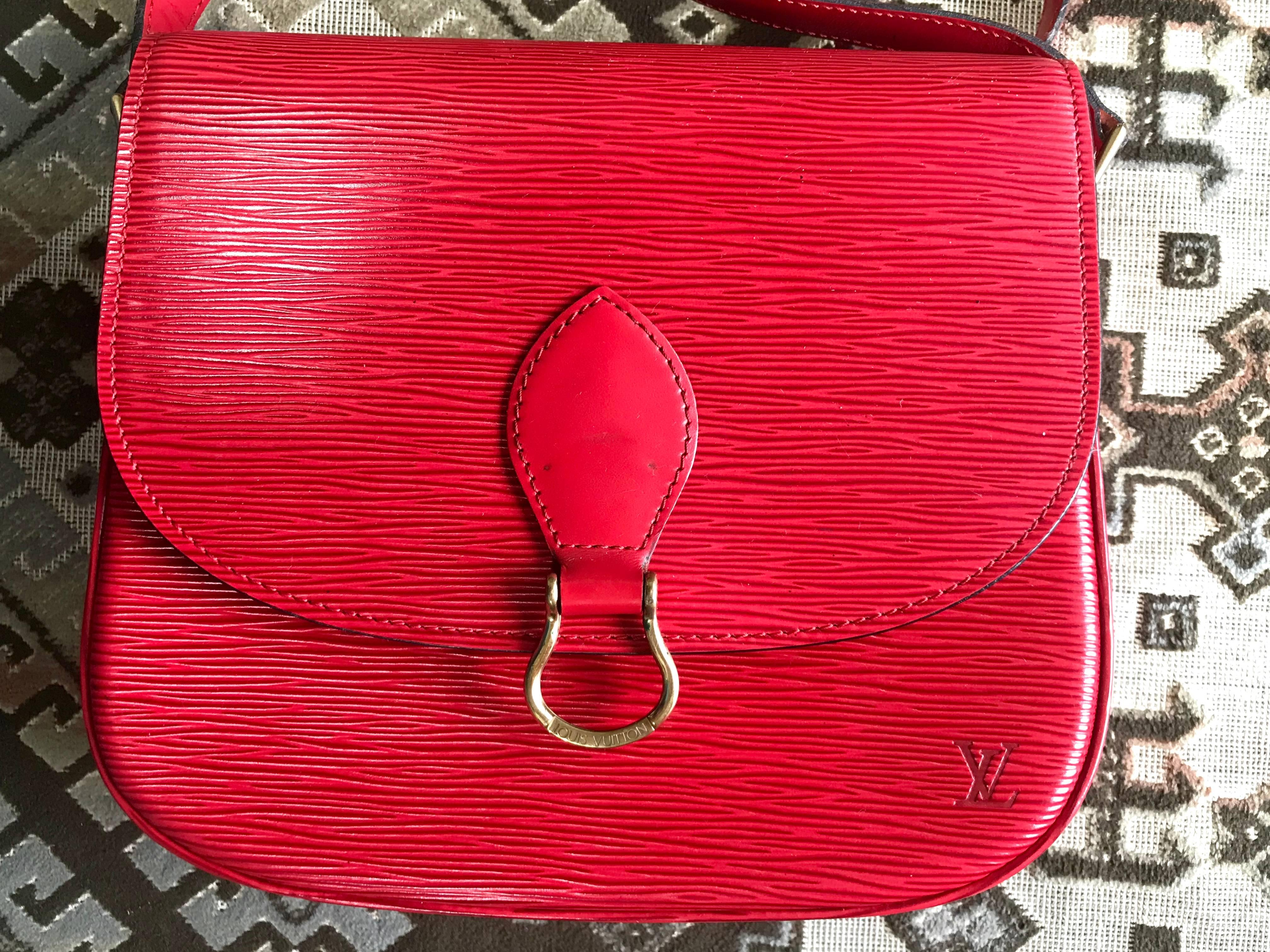 1990’s Vintage Louis Vuitton red epi leather shoulder bag. Classic purse. Perfect vintage accent to your outfit. Hot lipstick red. Great gift.

This is one of the most popular styles of vintage Louis Vuitton back in the 90's.

If you are looking for