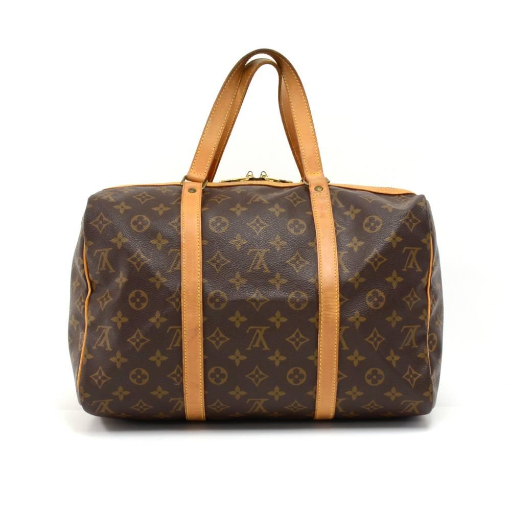 Vintage Louis Vuitton Sac Souple 35 is a classic of the Louis Vuitton small duffle bag collection. Discontinued in the early '90s. A great companion wherever you go.  Comes with name tag and poignees.  SKU: LP187

Made in: France
Serial Number: TH