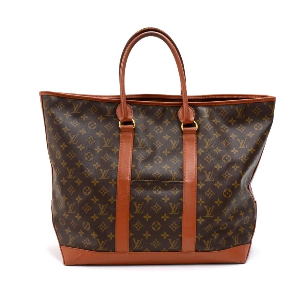 Vintage Louis Vuitton Sac Weekend GM tote bag in monogram canvas. It has 1 exterior small open pocketon front. Open access with 1 large interior pocket with zipper.  SKU: LO796

Made in: France
Serial Number: TH 0940
Size: 19.7 x 15.4 x 7.5 inches