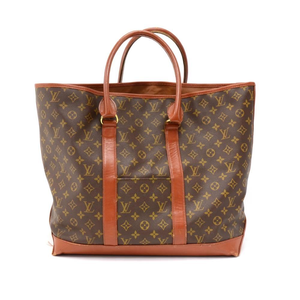 Vintage Louis Vuitton Sac Weekend tote bag in monogram canvas. It has 1 exterior small open pocket on each side. Open access with 1 large interior pocket with zipper.  SKU: LP065
Made in: France
Serial Number: Vintage, no serial #
Size: 15.7 x 11.8
