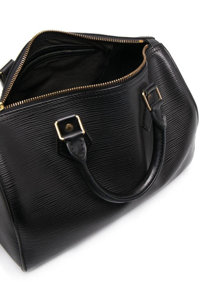 The Louis Vuitton Speedy 25 handbag is perfect for that weekend getaway. Expertly crafted in France from black EPI leather and accented with an embossed Louis Vuitton logo, this inspired piece features round top handles and opens with a double top