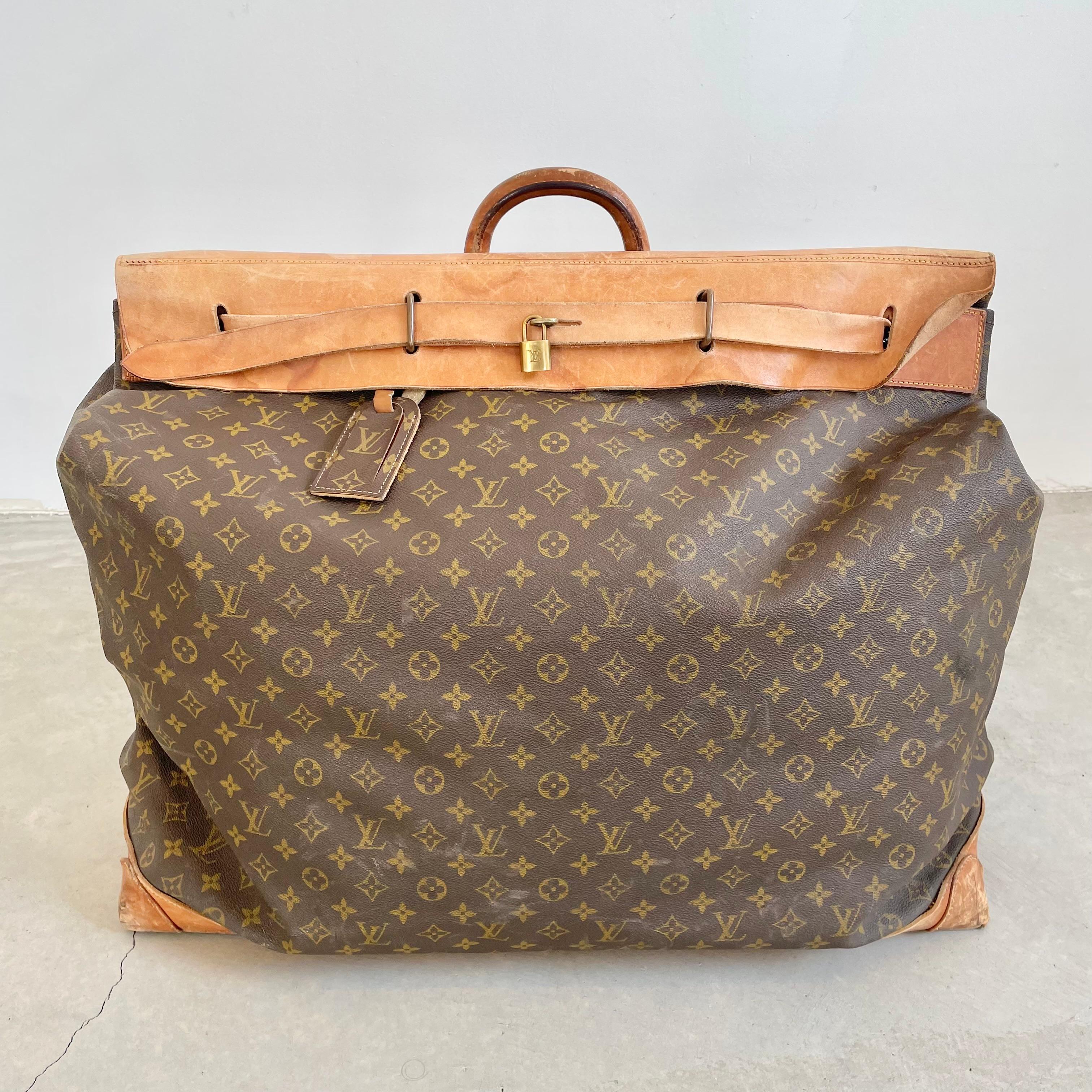 Classic vintage Louis Vuitton steamer bag. Large, oversized bag, perfect for weekend trips. LV monogram print with saddle leather and brass hardware. Timeless simplicity in design and iconic badging have made this a coveted bag for the last 75