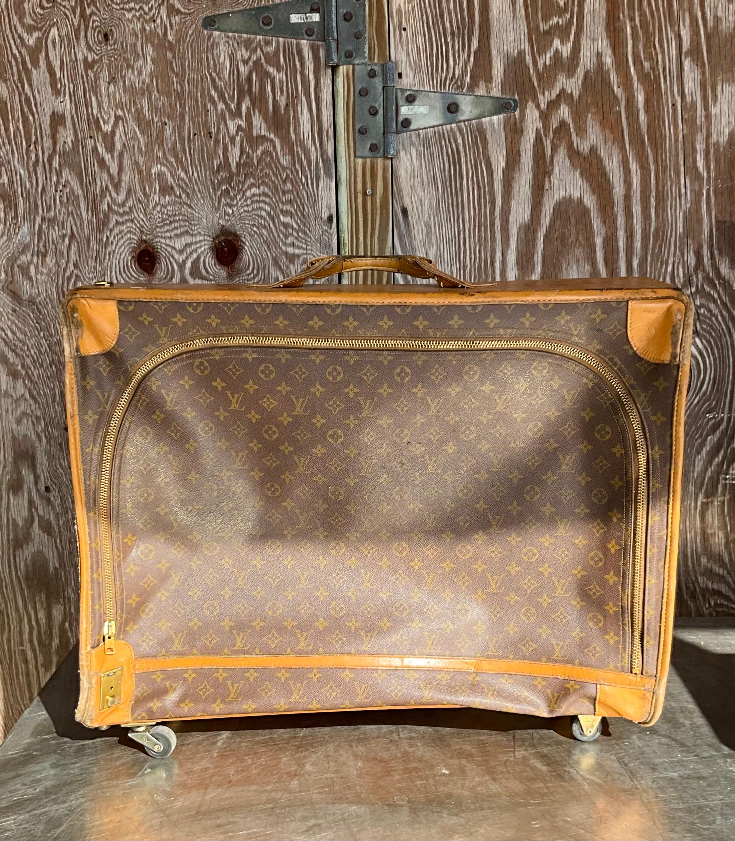 This Vintage Louis Vuitton XL Trunk with Wheels is a stunning and rare piece of luxury luggage that blends classic craftsmanship with modern functionality.

The trunk is made from Louis Vuitton's signature Monogram canvas, a durable and recognizable