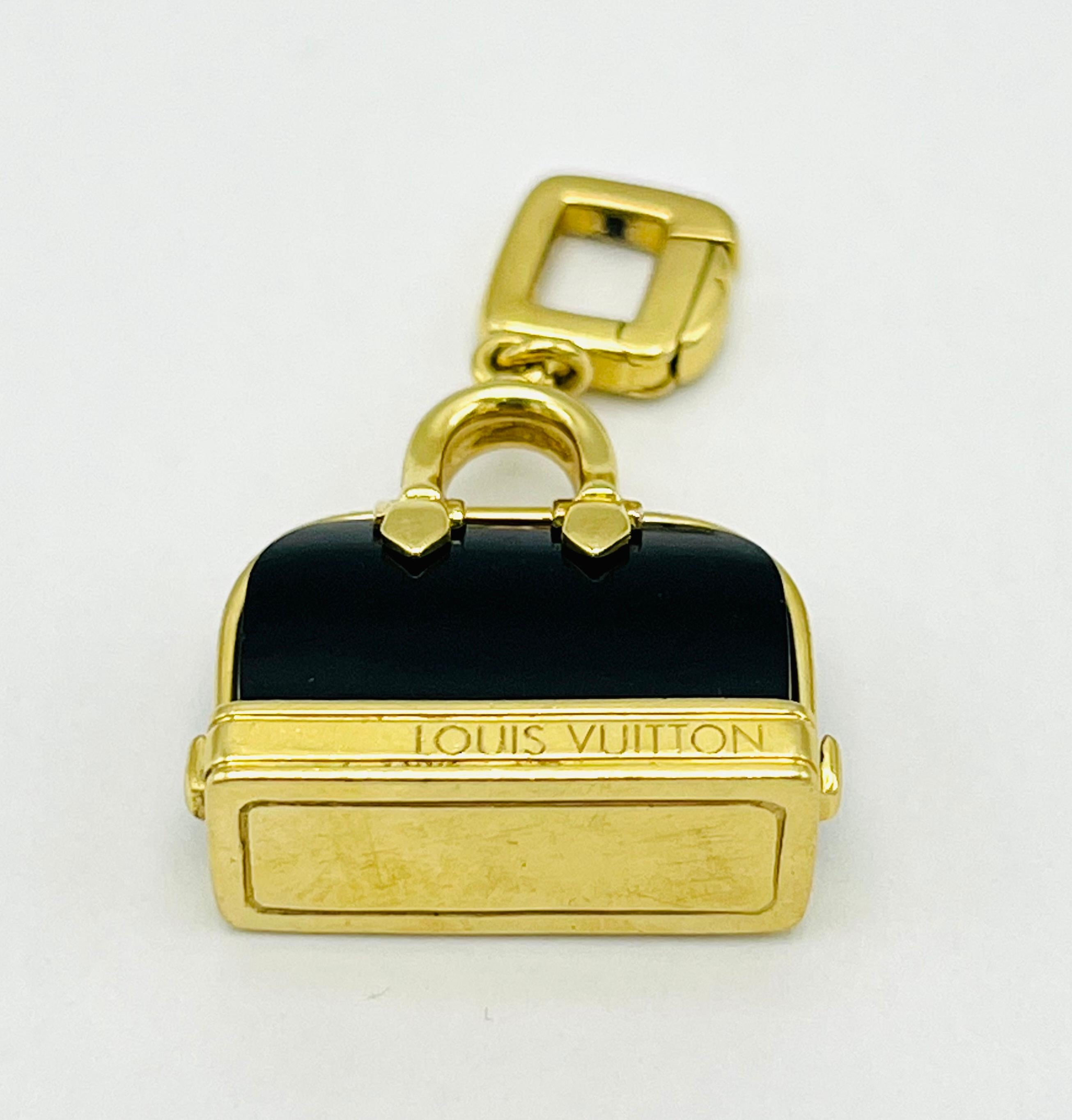 Product details:

The charm is designed by Louis Vuitton, it is made out of 18K yellow gold and black enamel.