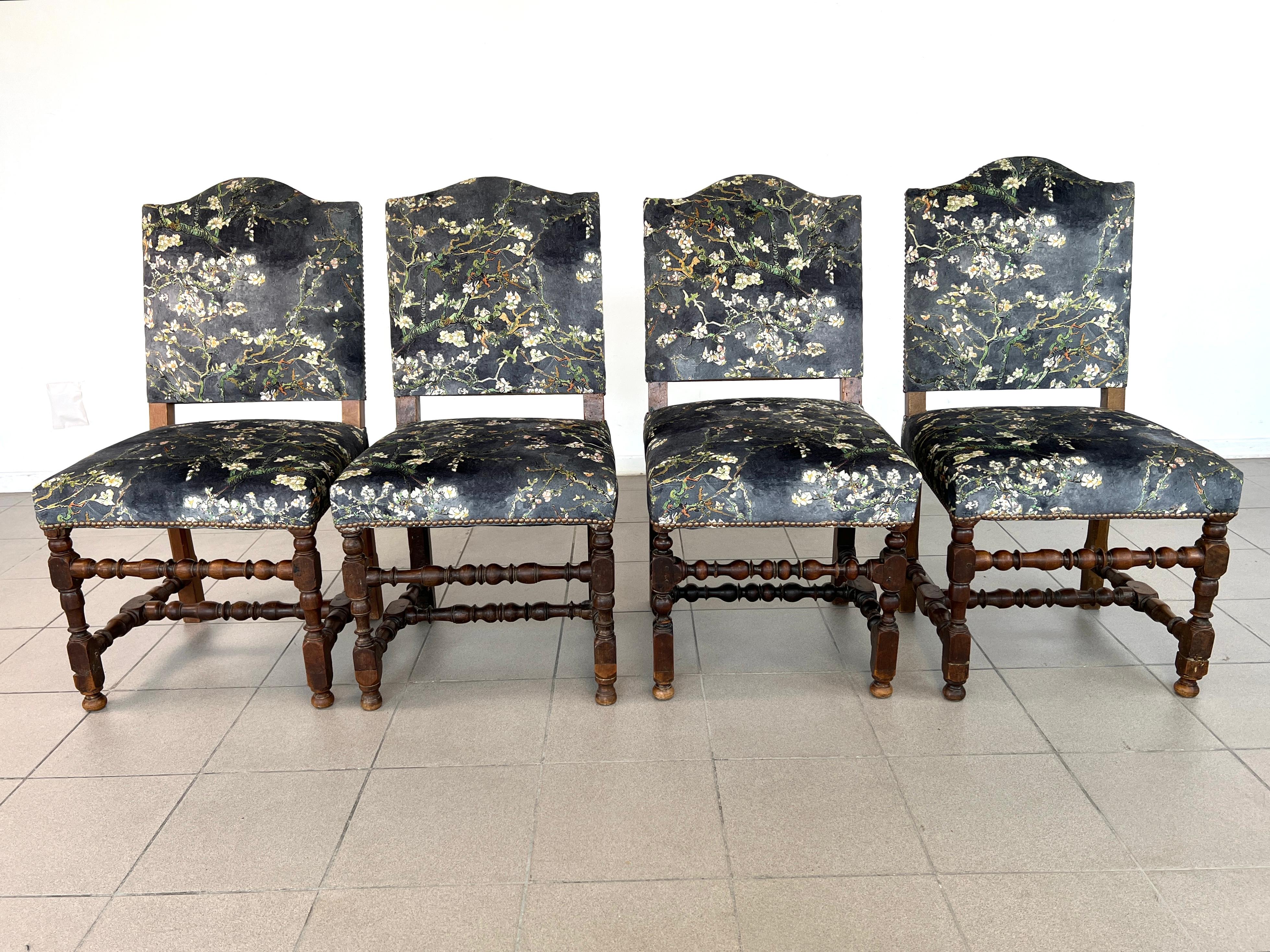 Dimensions: H 39.5” x W 20”/19” x D 25.5”/23.5” x SH 19”

Set of 4 Vintage Louis XIII style dining chairs, upholstered in original Chinoiserie style upholstery with brass nailhead trim. Raised on turned legs with stretchers. One of the chairs is
