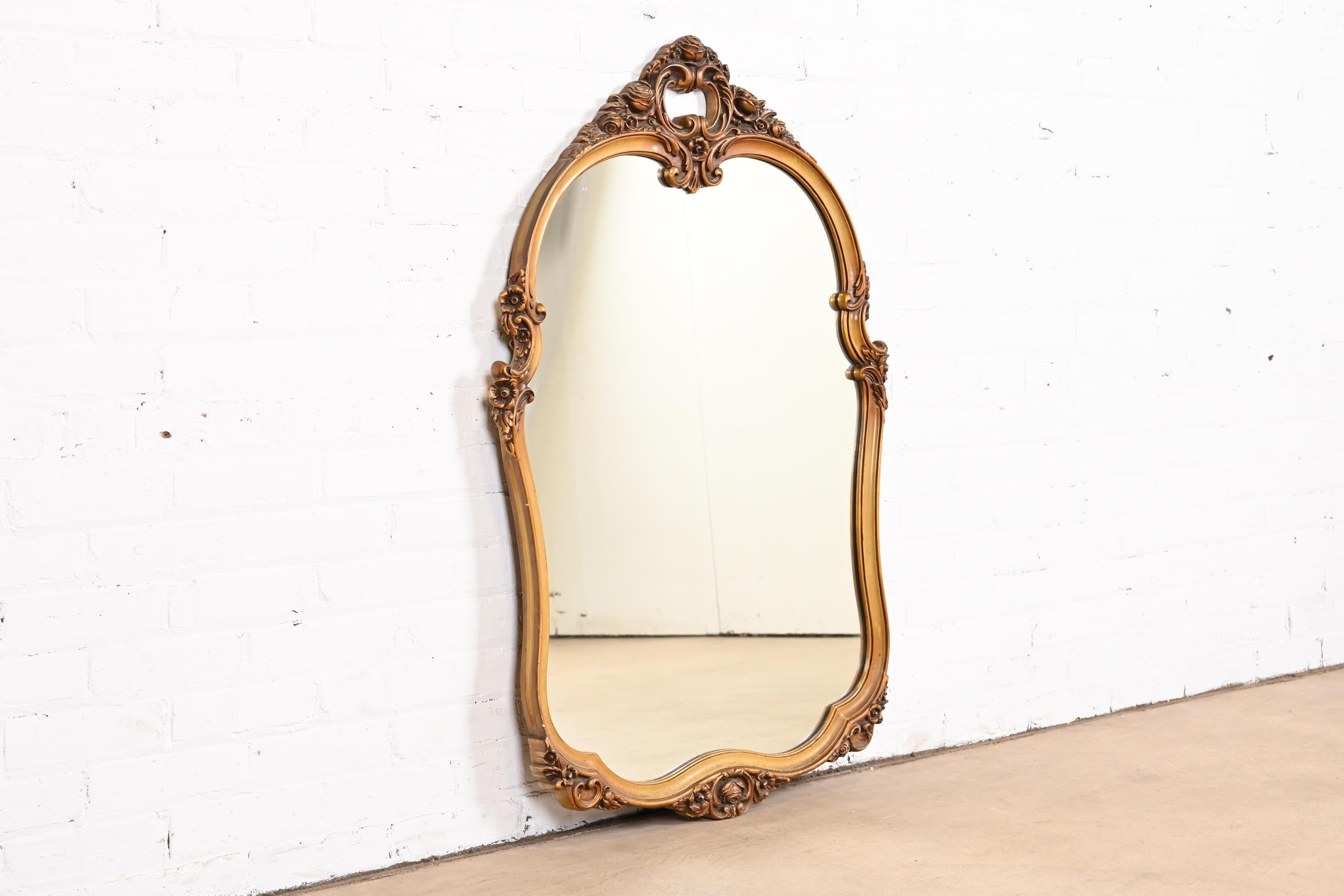 A gorgeous vintage Louis XV French Rococo style carved giltwood framed wall mirror

Early 20th Century

Measures: 29.25