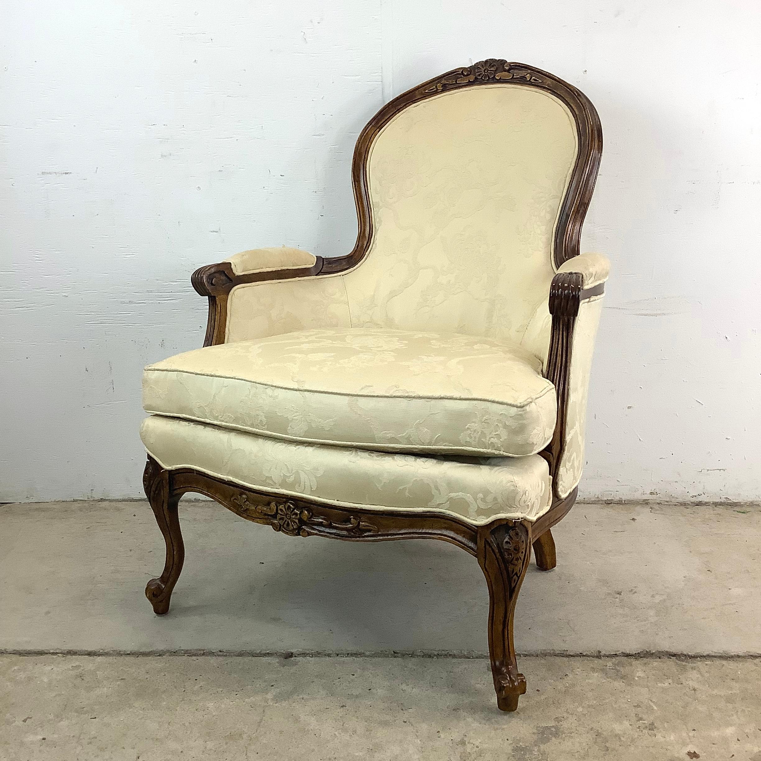 Add a touch of vintage elegance to your home with this Louis XV Style Bergère Armchair by Bernhardt Furniture. The finely carved wood frame of this chair is a true work of art, capturing the graceful lines and intricate details characteristic of the