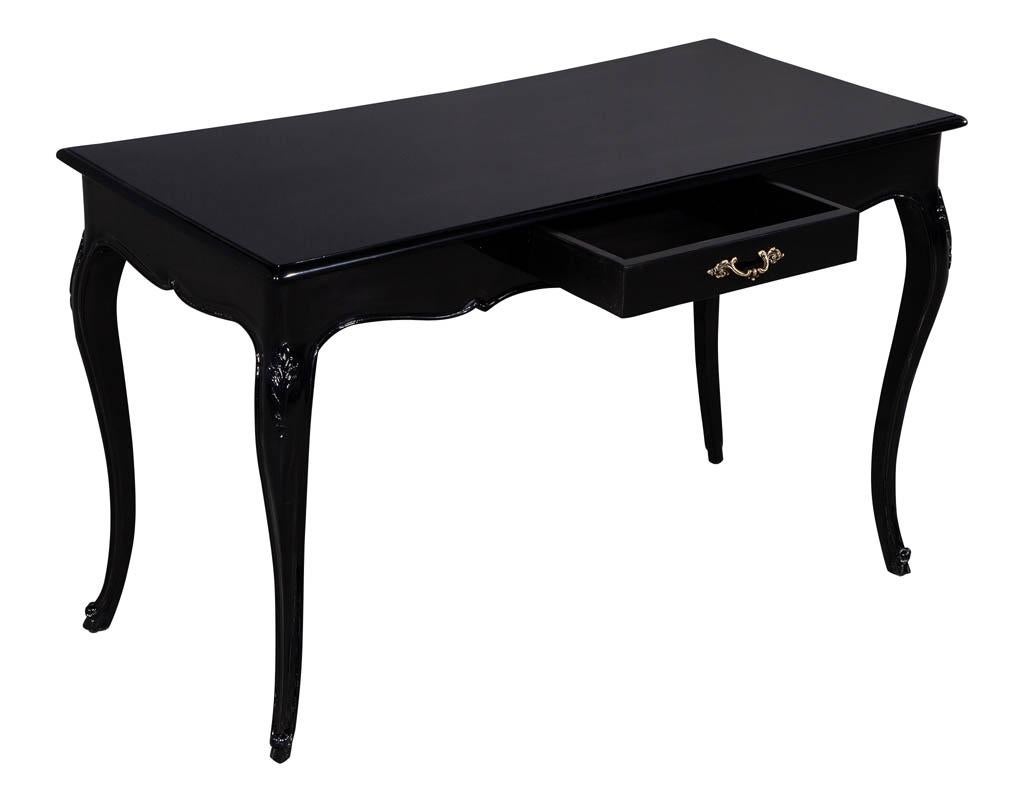 Vintage Louis XV style black lacquer desk. Vintage hand polished black lacquer desk with cabriole legs and original hardware. Desk top has minor warping consistent with age.

Price includes complimentary scheduled curb side delivery service to the