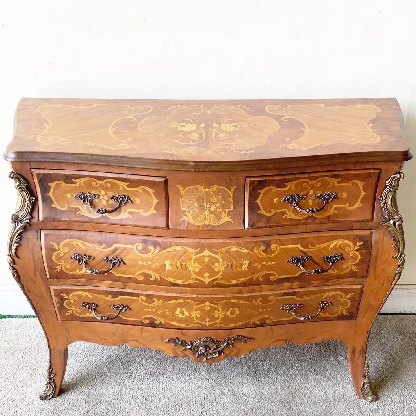 Exceptional Louis XV style, chest of drawers/commode. Wonderful brass ormolu accents and hardware. Two small drawers over two large drawers.
